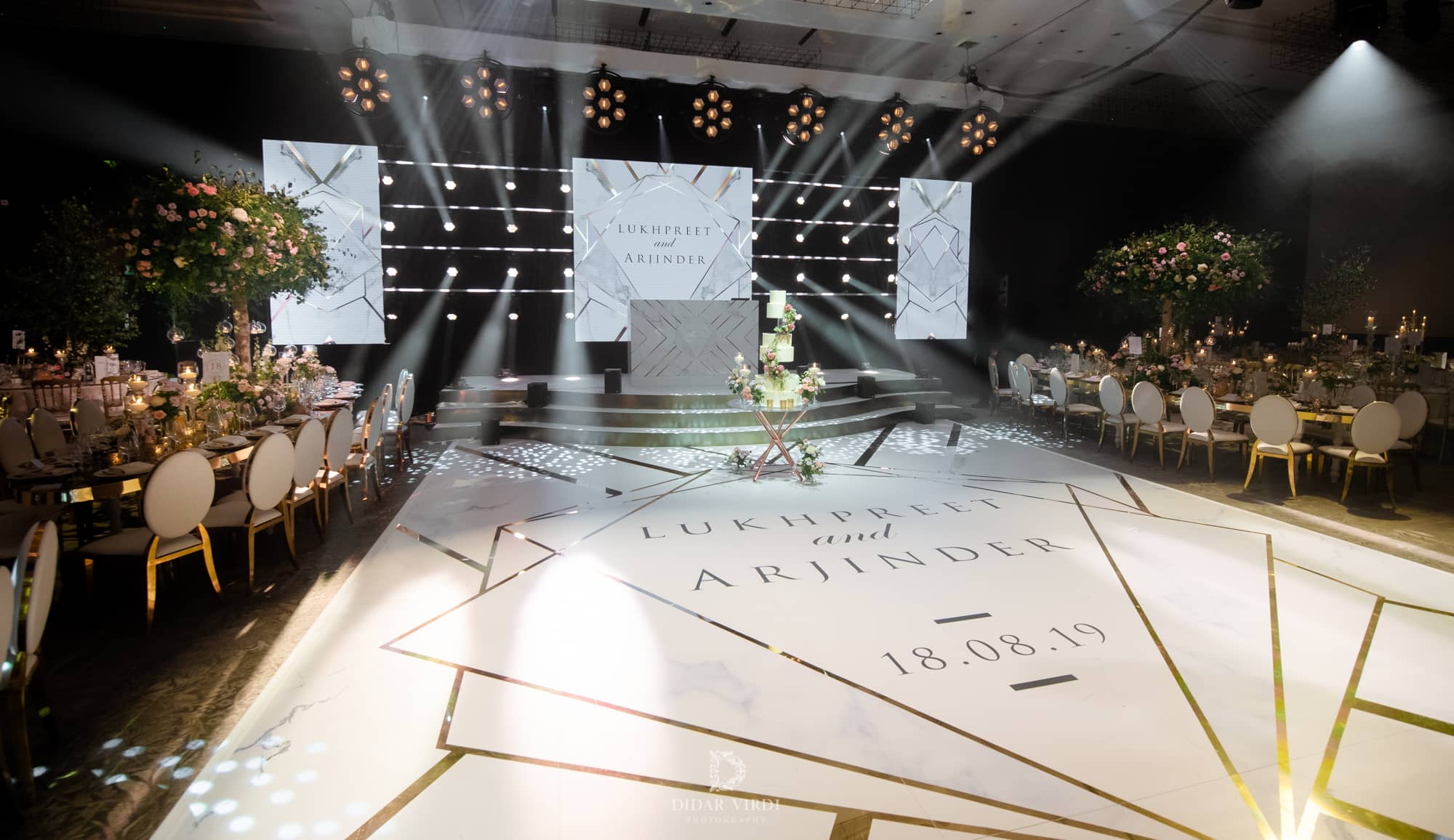 Luxury wedding at Hilton London Bankside, the printed geometric dancefloor and LED stage, by Kudos AV