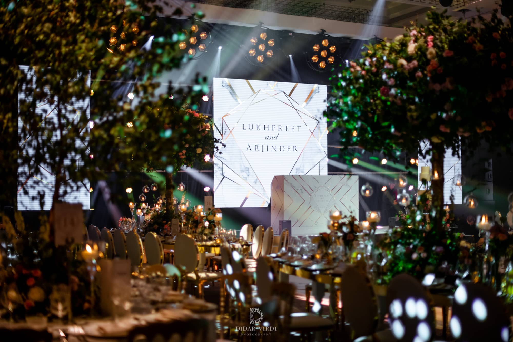 Luxury wedding at Hilton London Bankside, tall floral centrepieces and LED screens, by Kudos AV