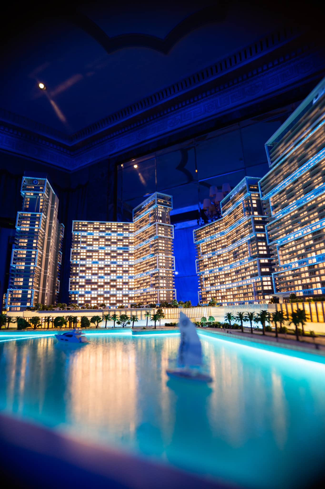 Close detail of the lit model towers and lagoon on the Chelsea Residences display