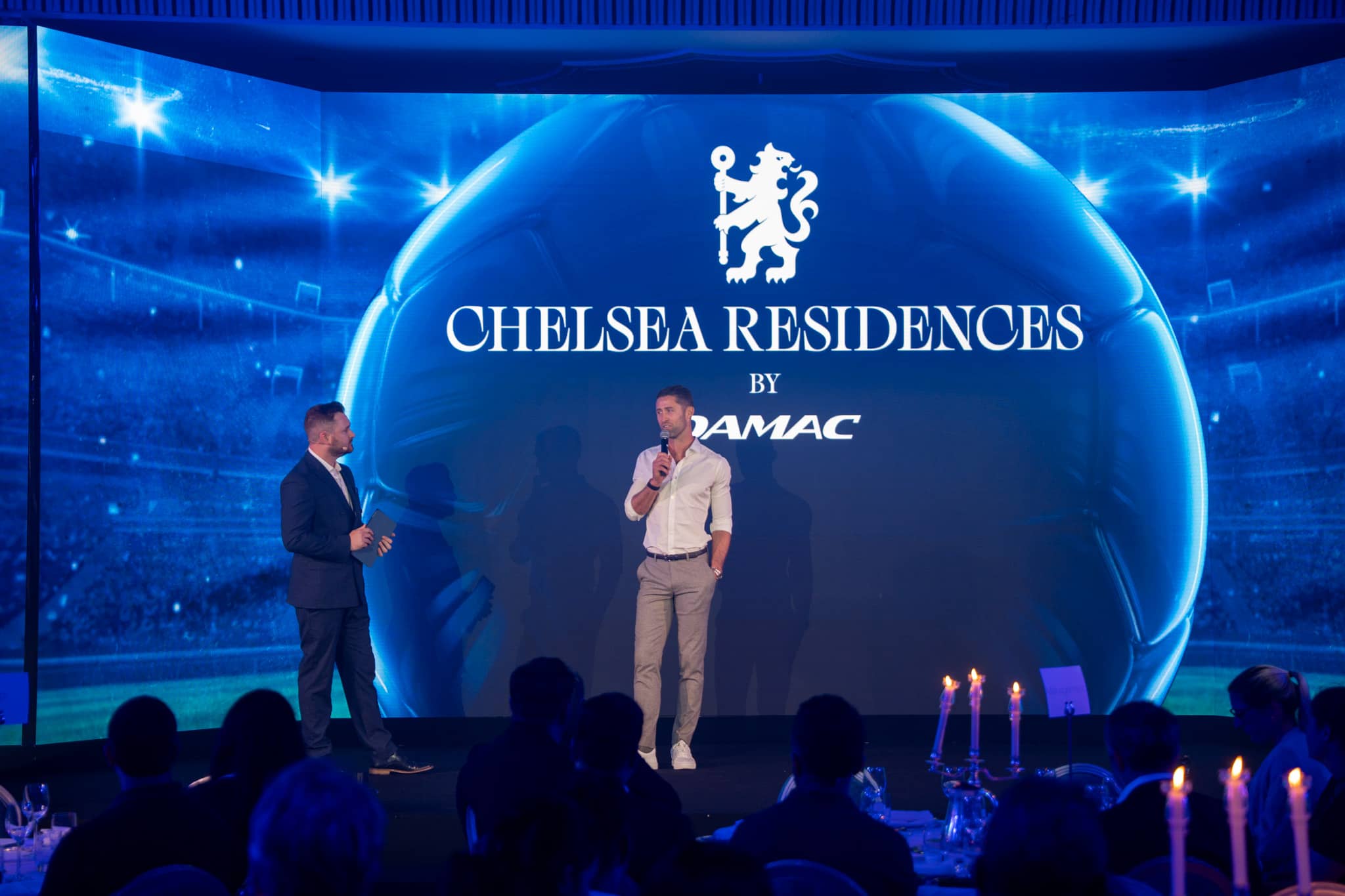 Gary Cahill interviewed on stage by a Chelsea TV presenter at the DAMAC property launch