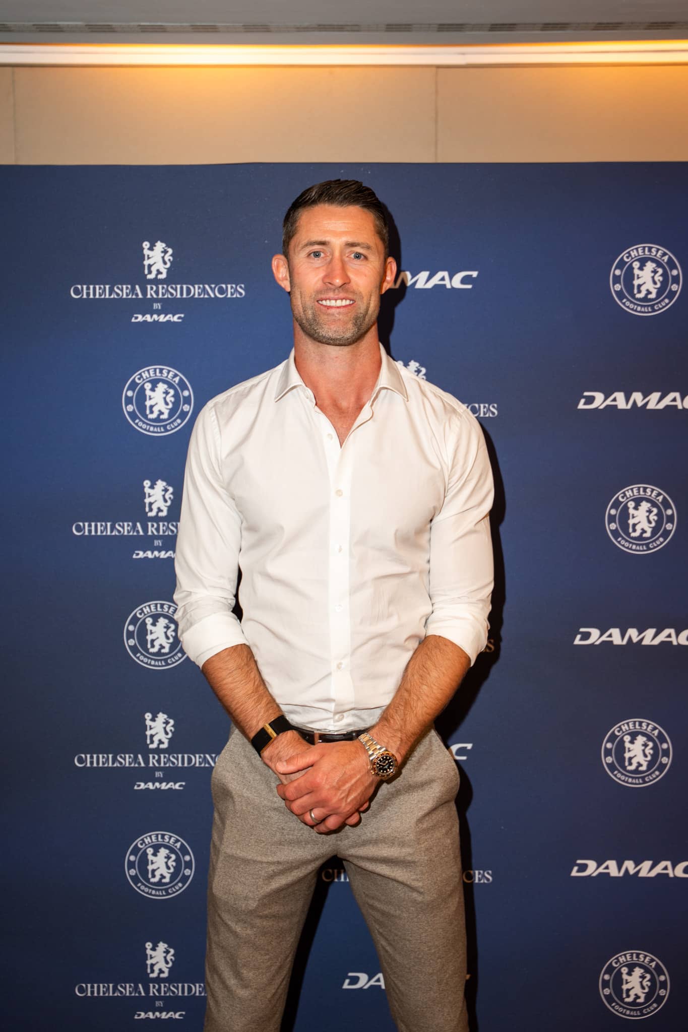 Gary Cahill photographed at the printed Chelsea Residences step-and-repeat wall