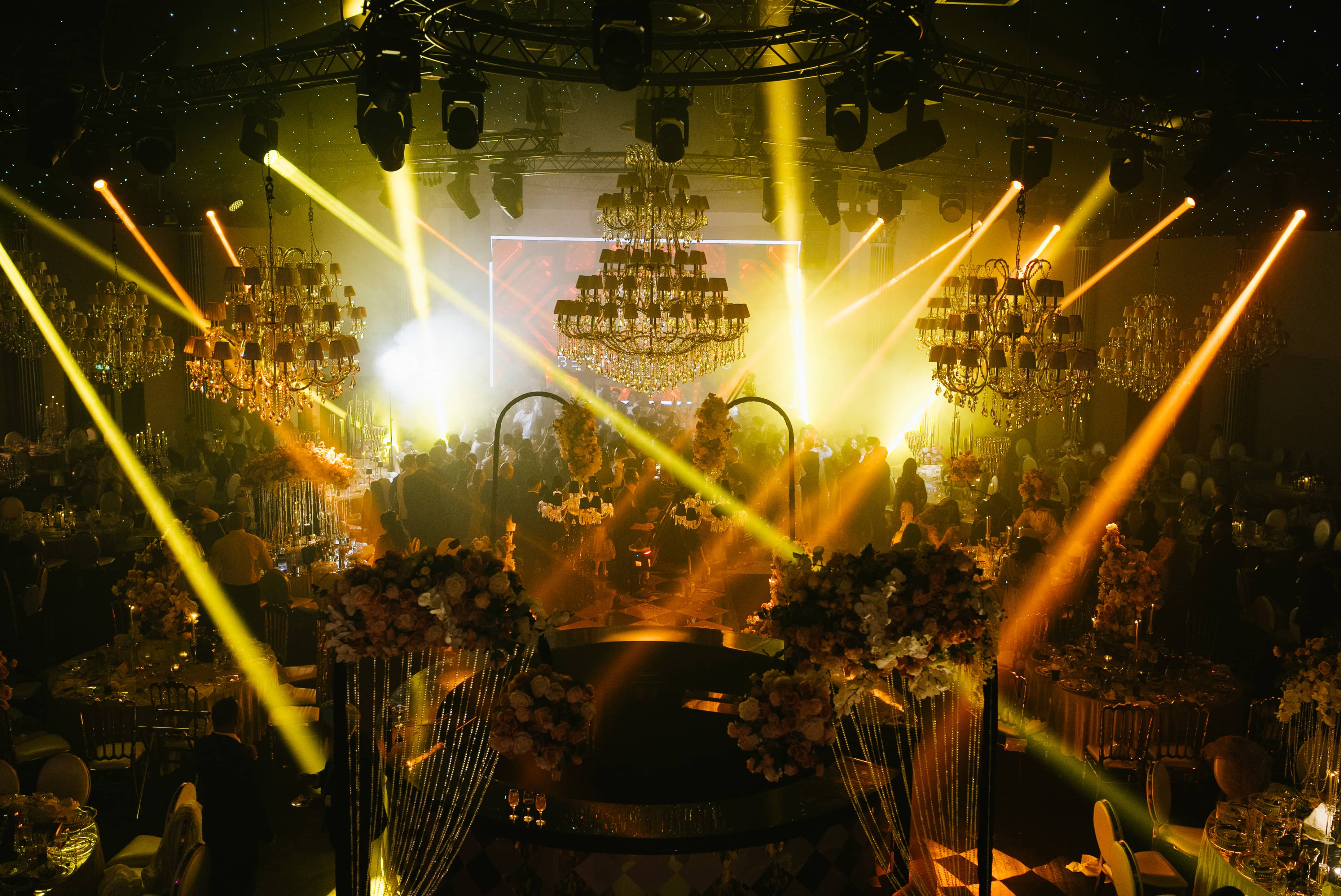Golden beams over the stage during the live performance, by Kudos AV