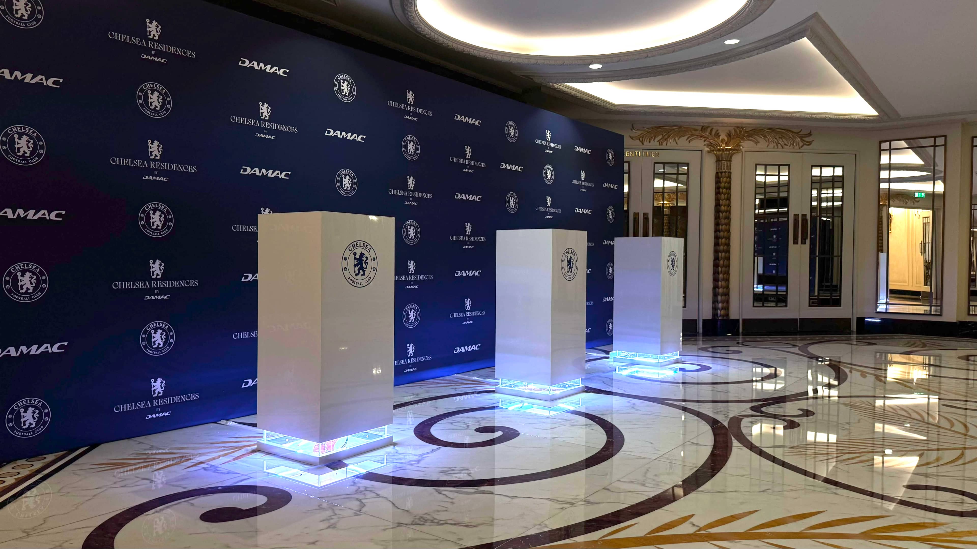 Illuminated printed display plinths and branded step and repeat media wall for a Chelsea FC event by Kudos AV