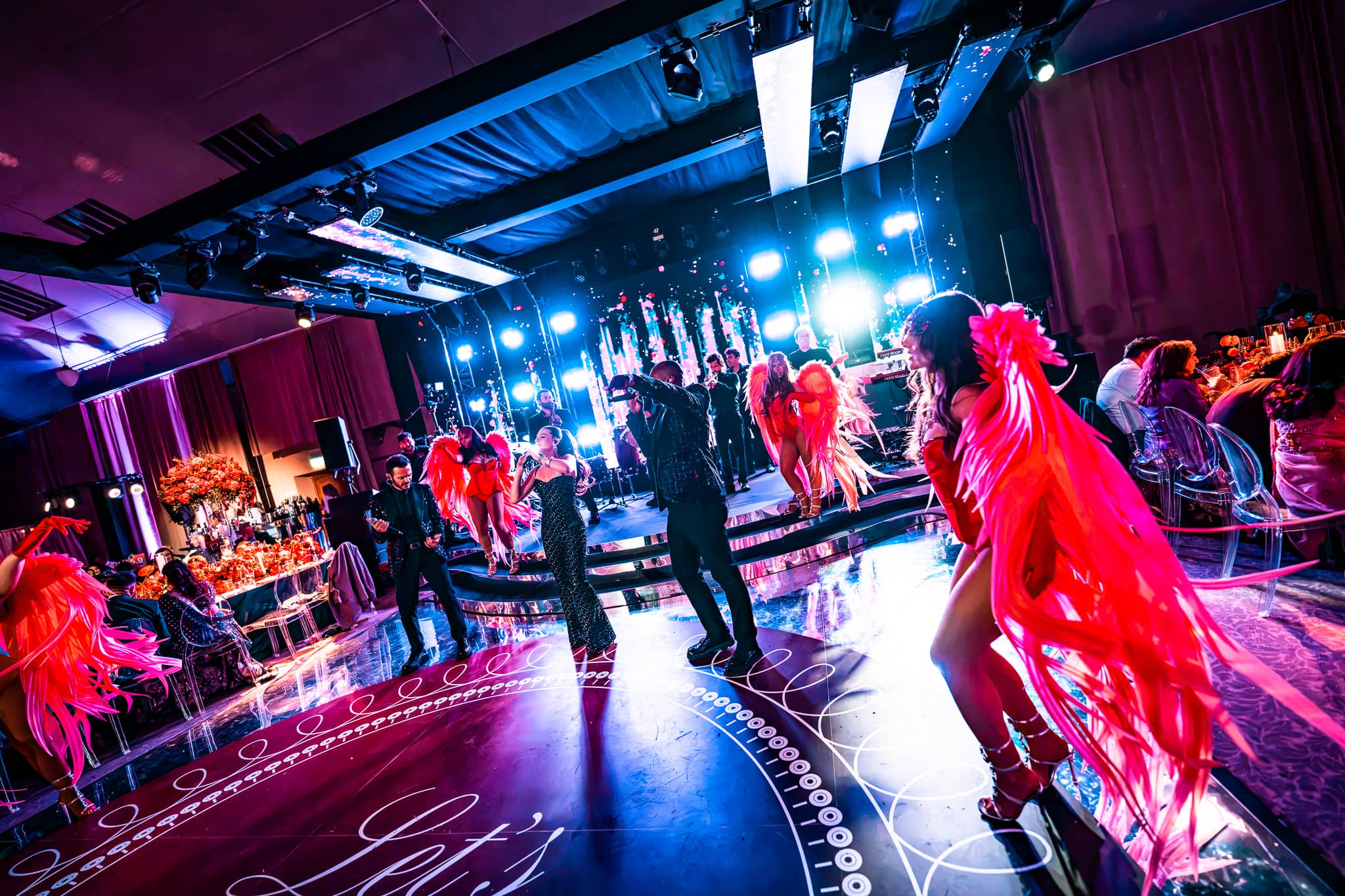 Tatton Park wedding in the Tenants' Hall, dancers with feather fans framing the dancefloor, produced by Kudos AV