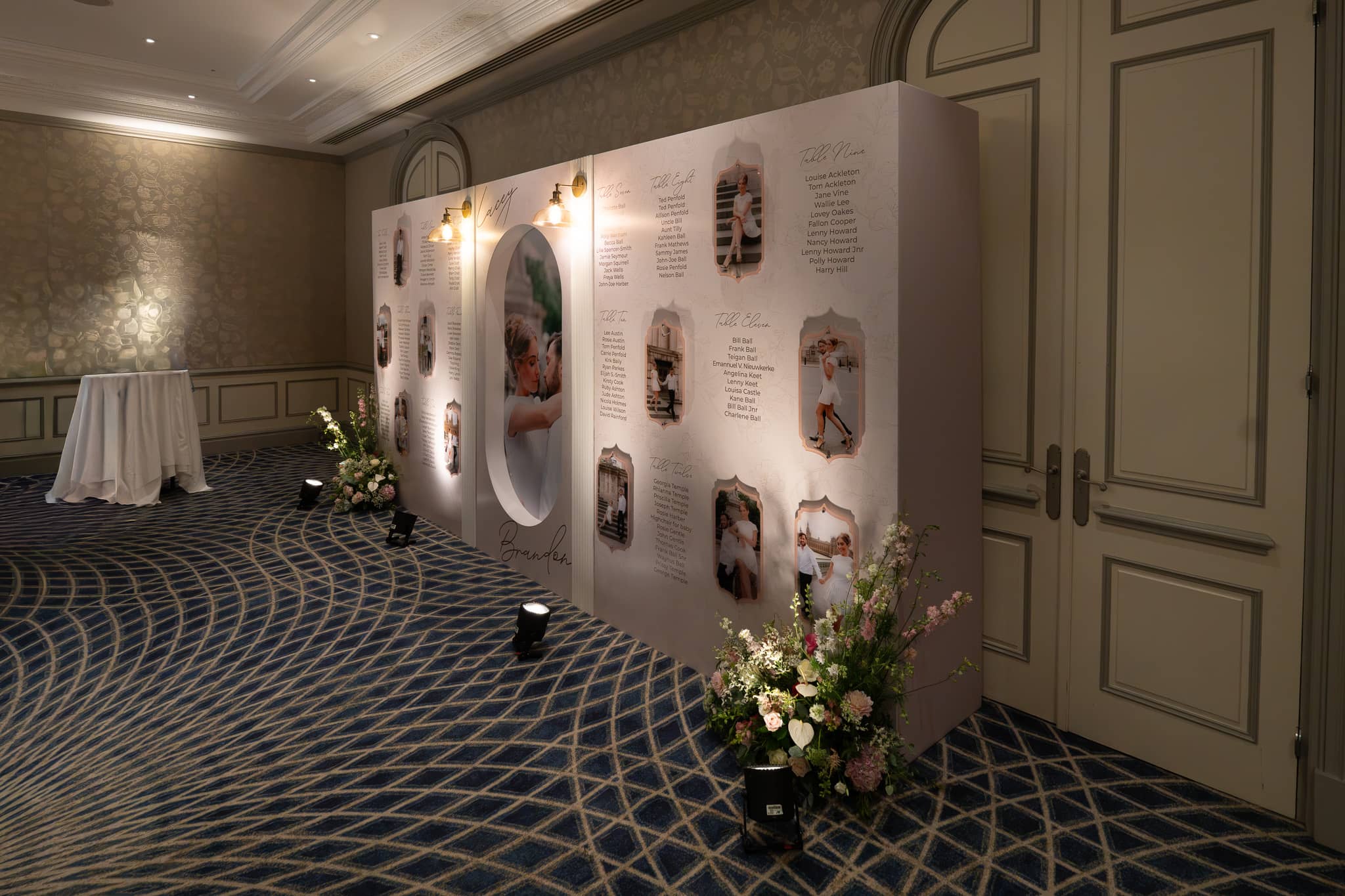The life size seating plan from the side at The Savoy, lamps along the top edge and florals at its base, printed by Kudos AV