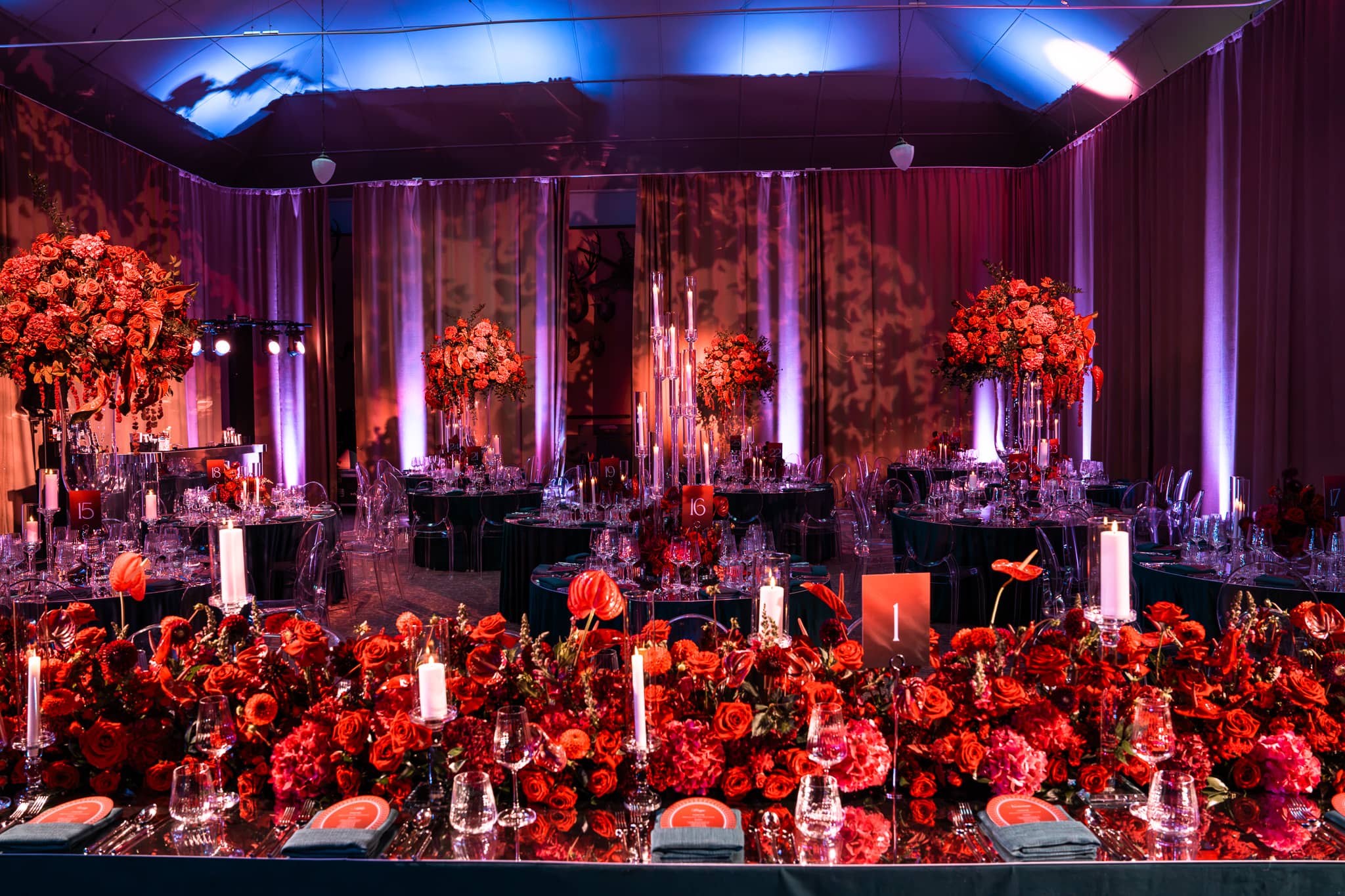 Tatton Park wedding in the Tenants' Hall, tall rose centrepieces on the family tables, produced by Kudos AV