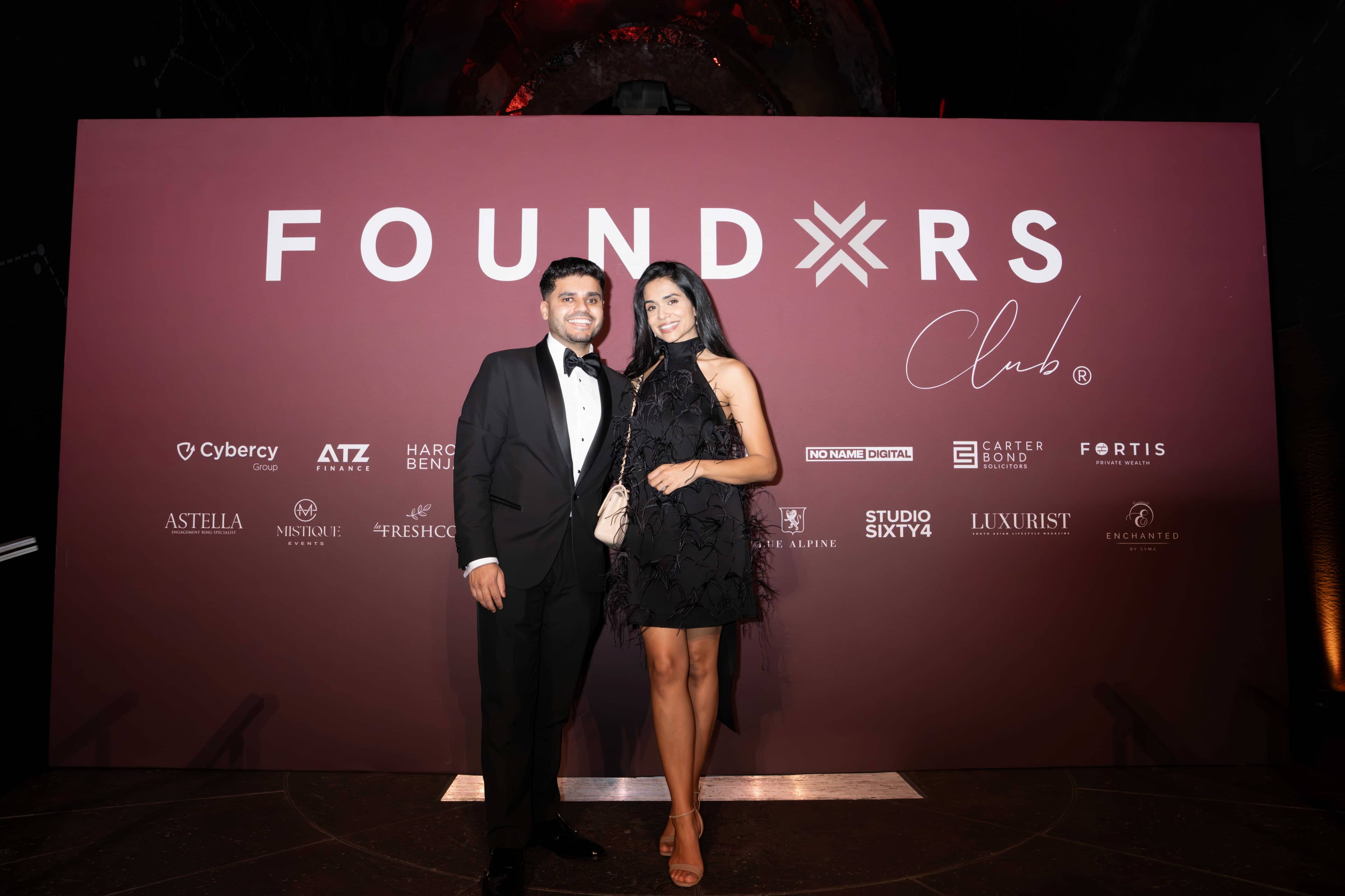 Two guests at the FOUNDXRS Club photo call in Earth Hall, FOUNDXRS Club black tie party at the Natural History Museum, by Kudos AV.