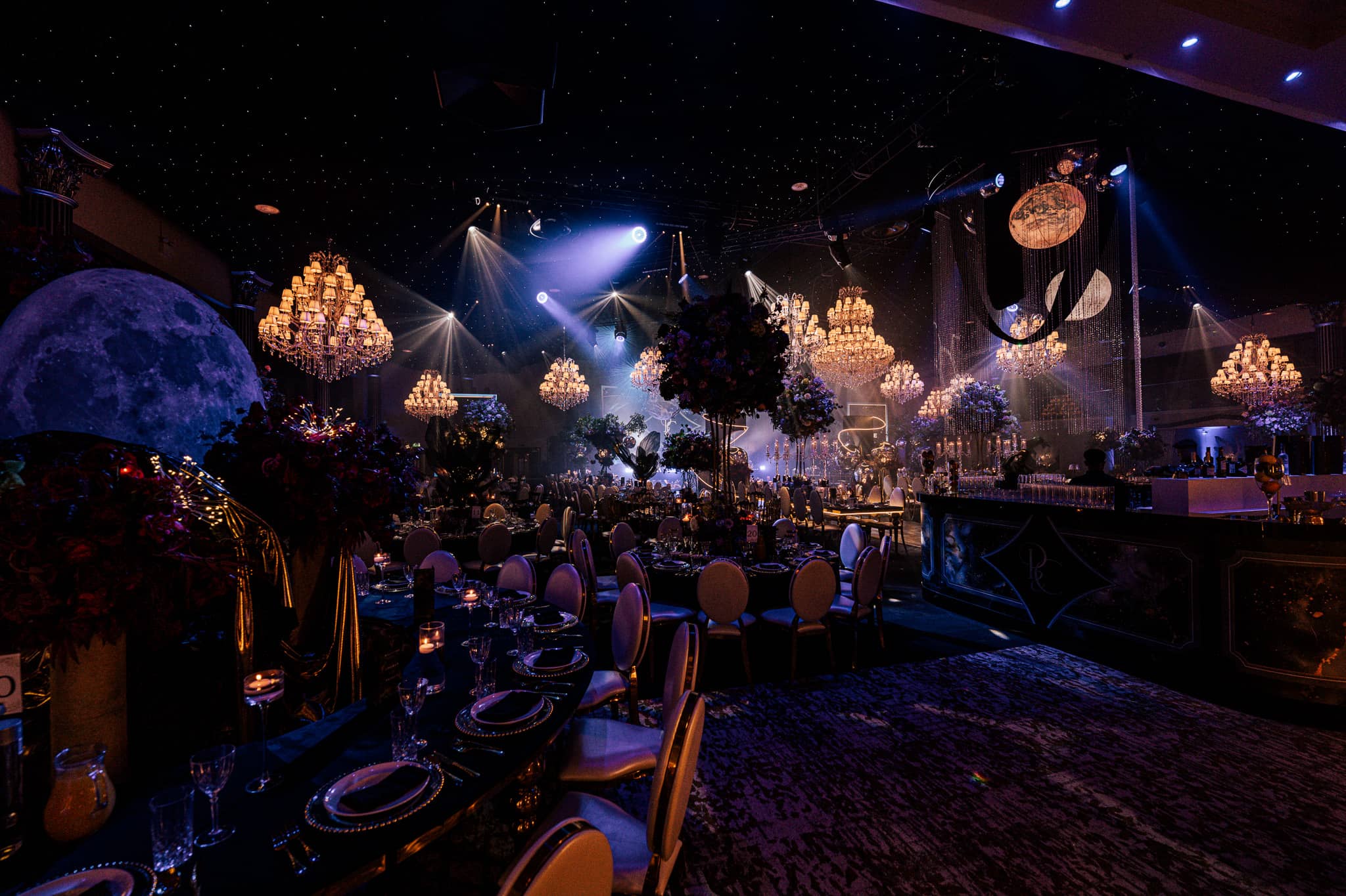 The IXL Events Centre set for 550 guests, chandeliers and stage lighting, by Kudos AV