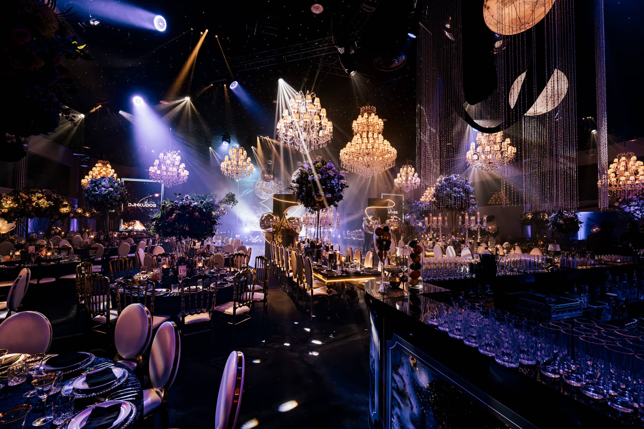 The stage lighting and chandeliers over the dining tables, by Kudos AV