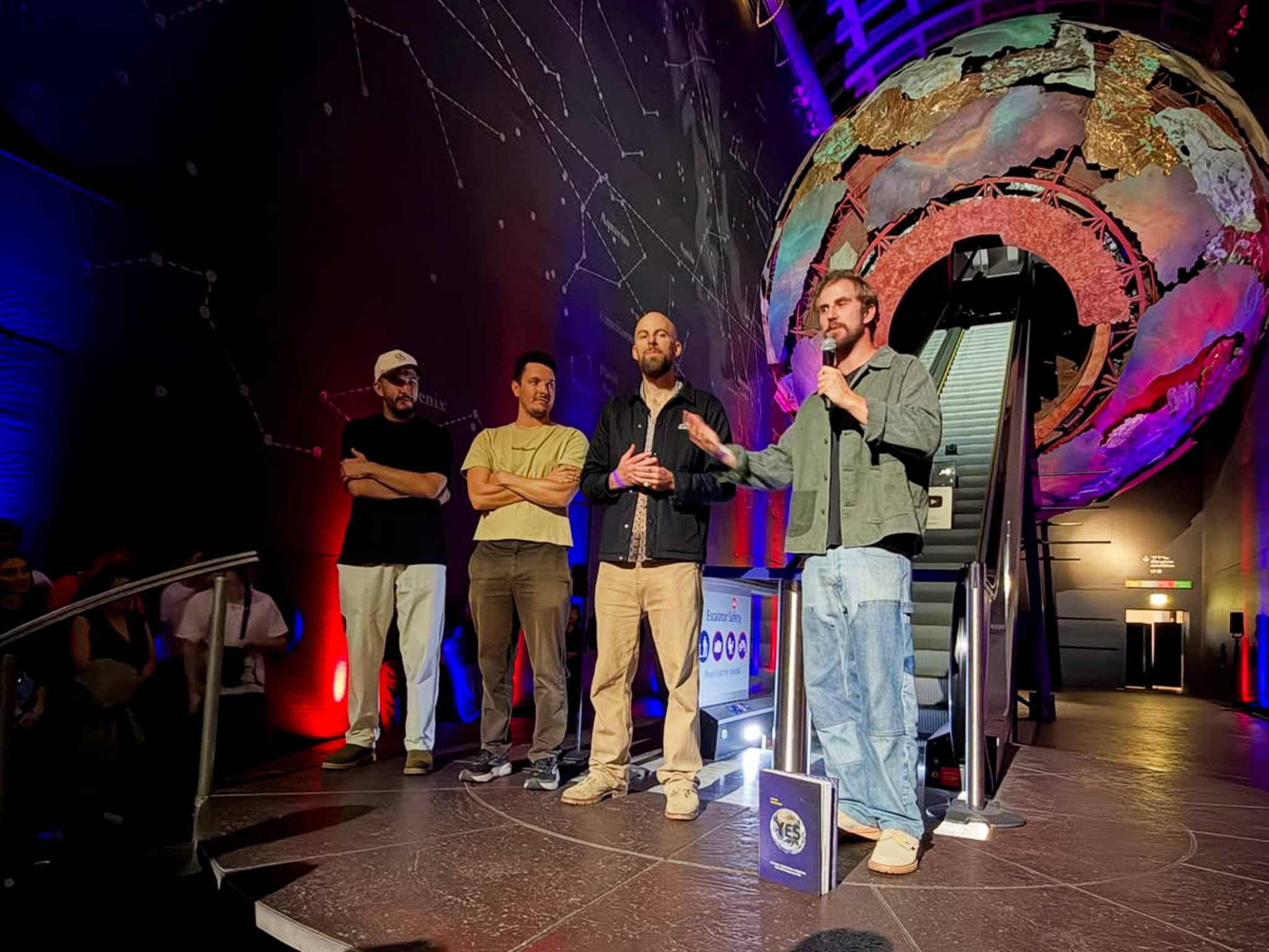 The Yes Theory team on stage in front of the lit Earth sculpture for the presentation of YouTube's 10 million subscriber Diamond Creator Award, Earth Hall, by Kudos AV.