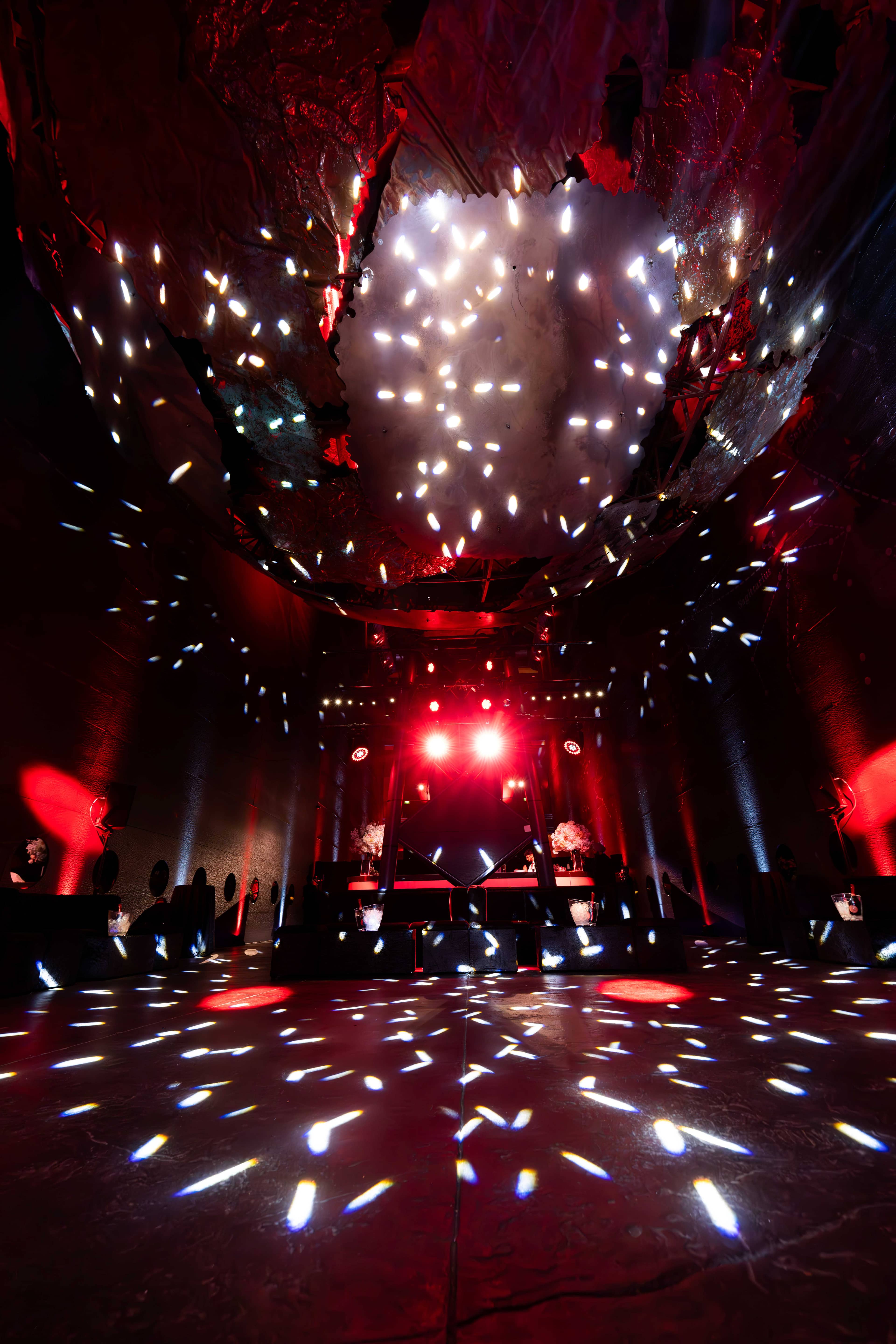Red and white light from the rig over the dancefloor in Earth Hall at the FOUNDXRS Club black tie party, by Kudos AV.