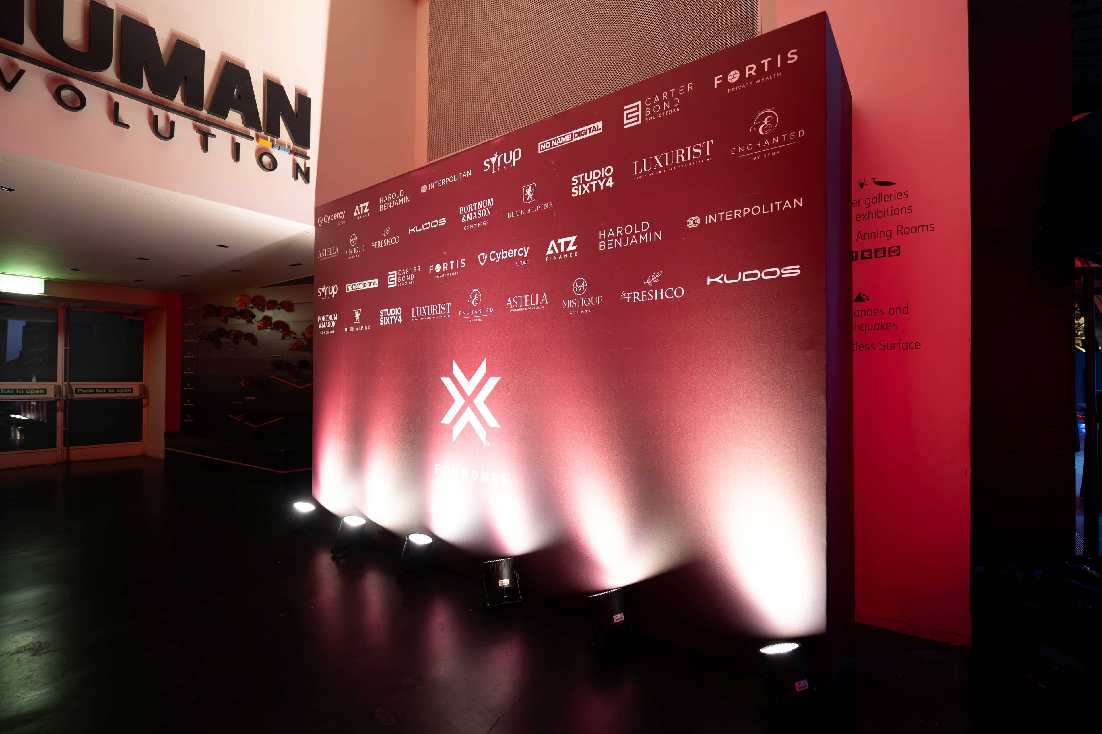 The FOUNDXRS star and the evening’s partner logos in red, FOUNDXRS Club black tie party in Earth Hall at the Natural History Museum.