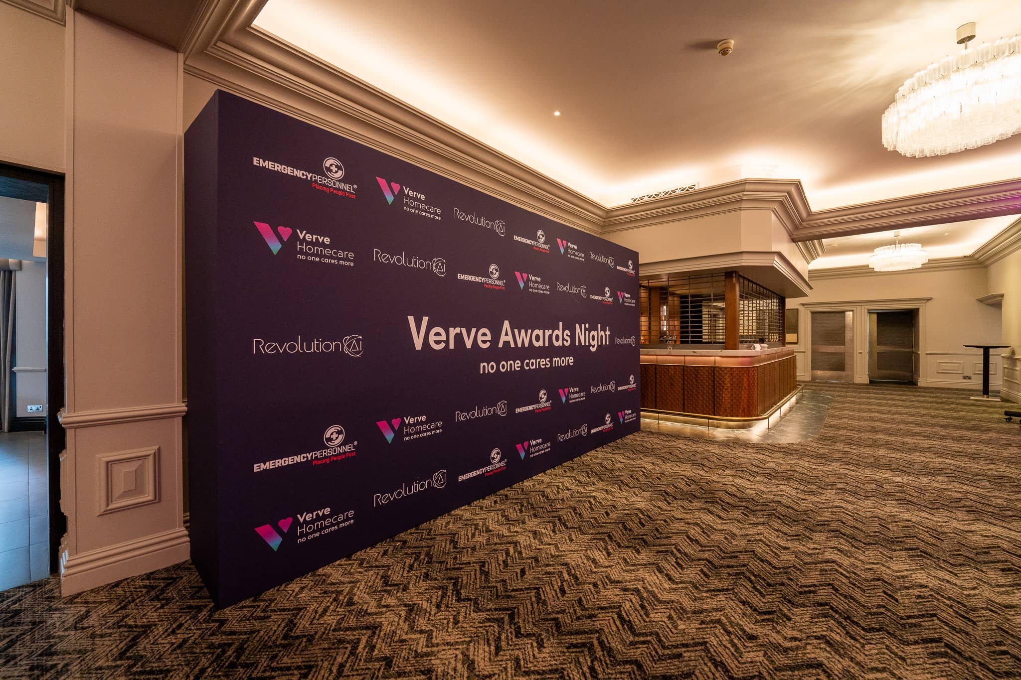 Angled view of the Verve Awards Night step and repeat backdrop beside the foyer bar at Sopwell House, ready for guest photos.