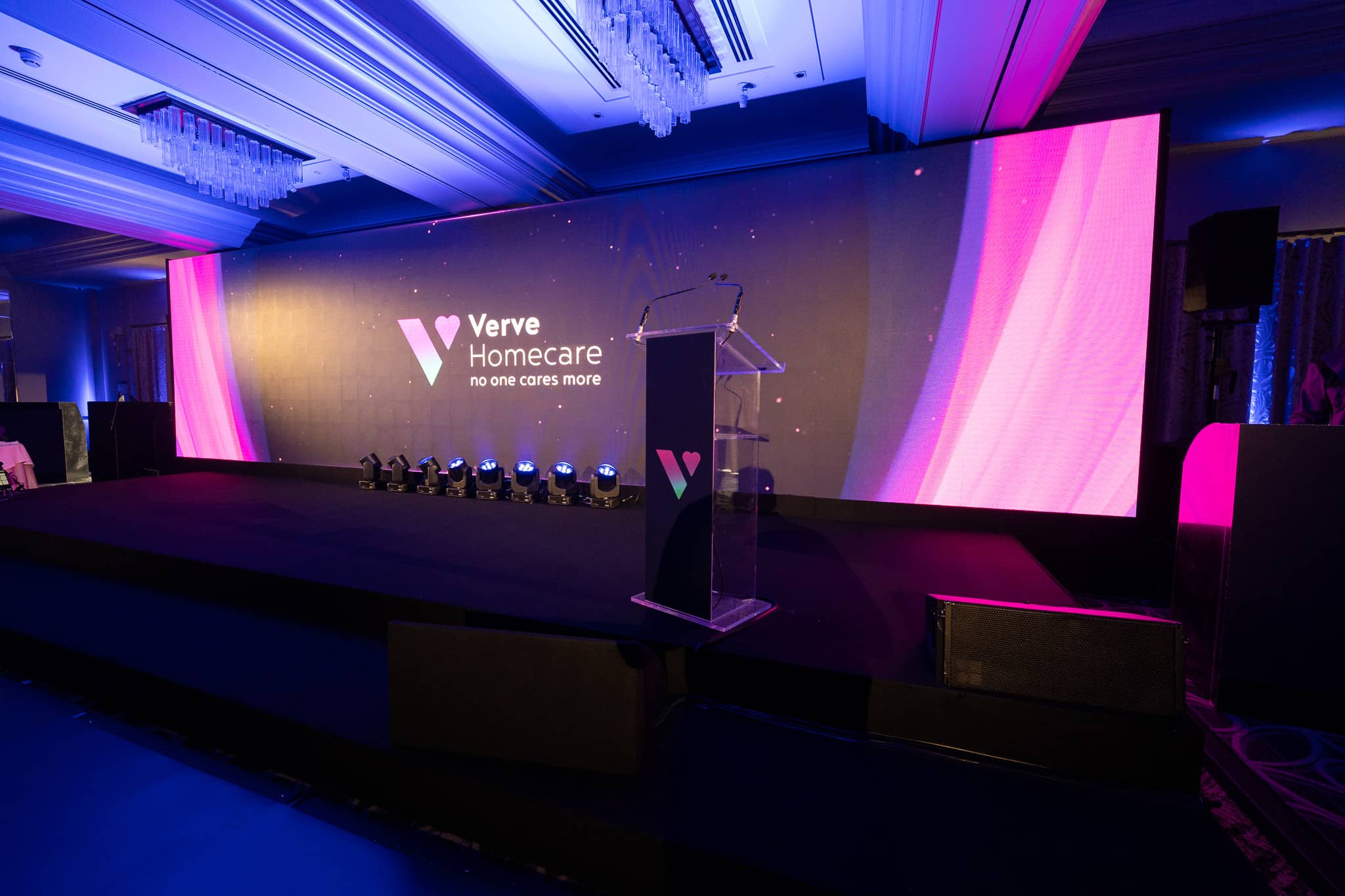 Front view of the Verve Homecare awards stage at Sopwell House: 20ft stage, acrylic lectern, front light and the 10m LED wall with brand content.