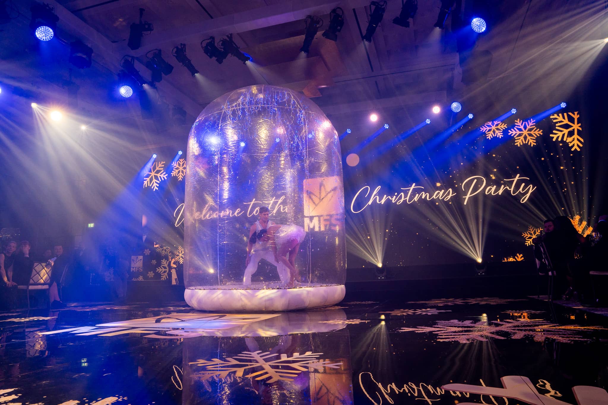 Snow-globe performance, blue and white beams and the reflective MFS dancefloor at The Peninsula London