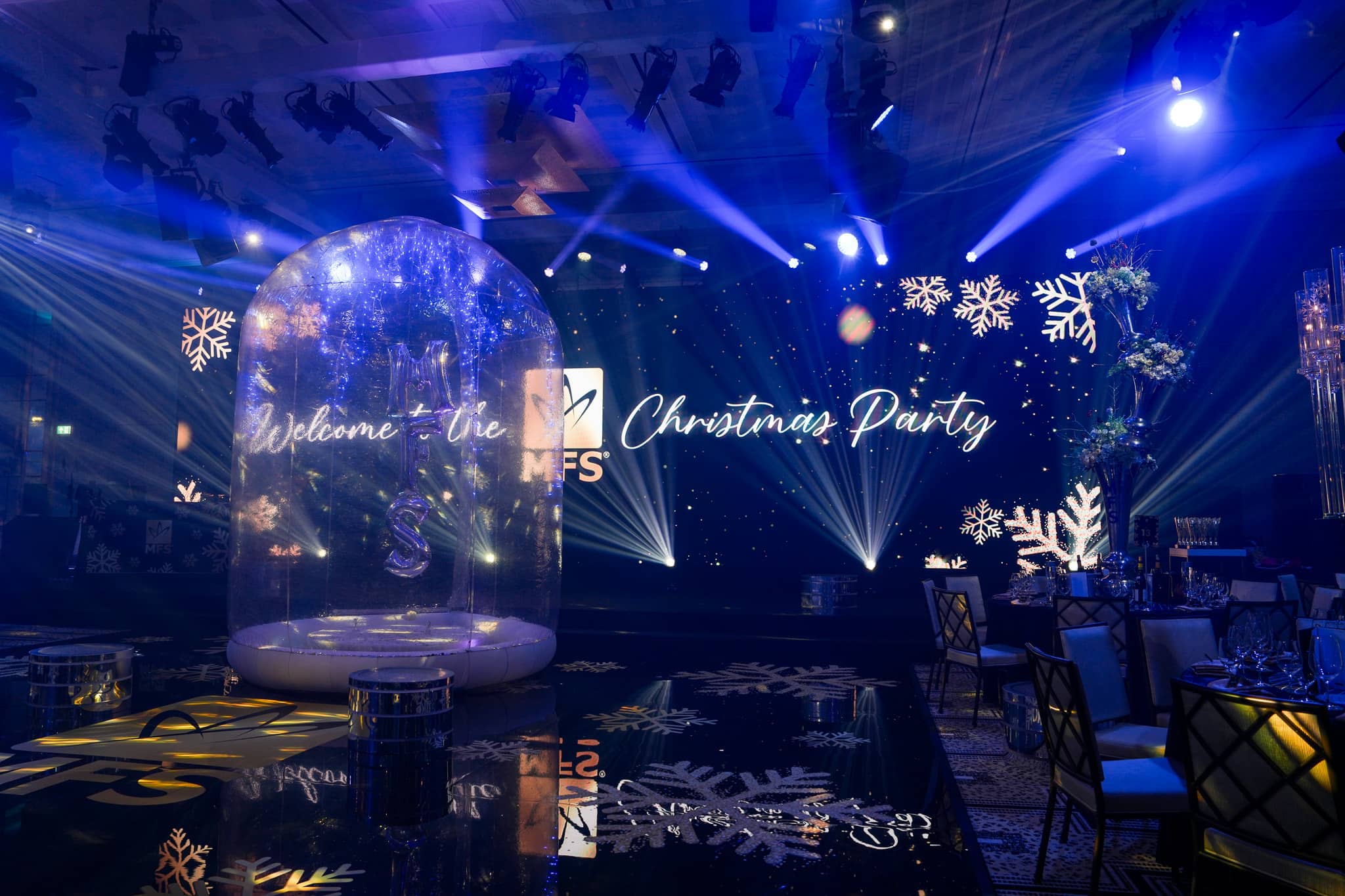 MFS Christmas party welcome artwork on the LED screen behind the snow globe at The Peninsula London