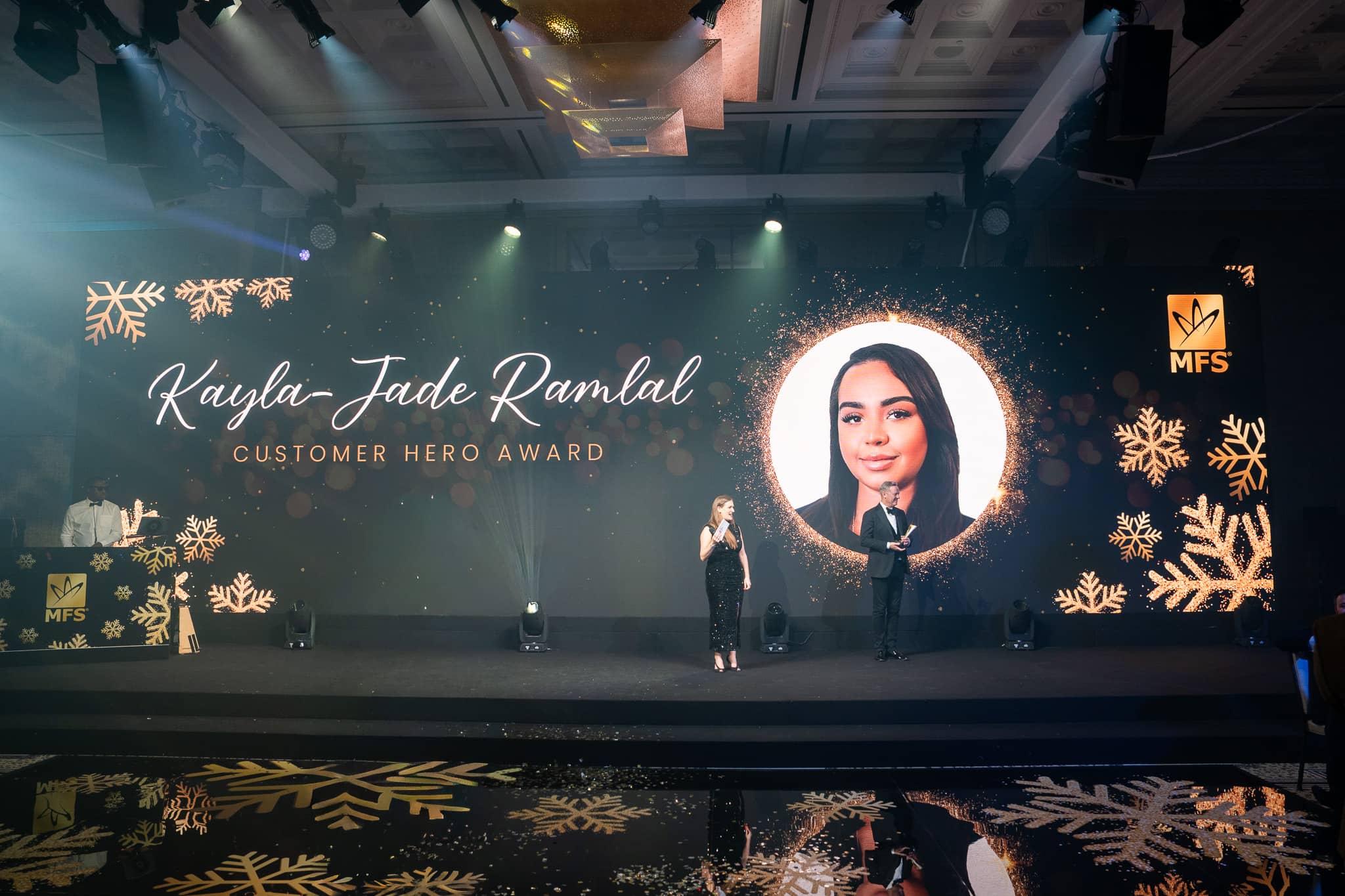 Customer Hero Award announcement on the MFS LED screen above the printed dancefloor
