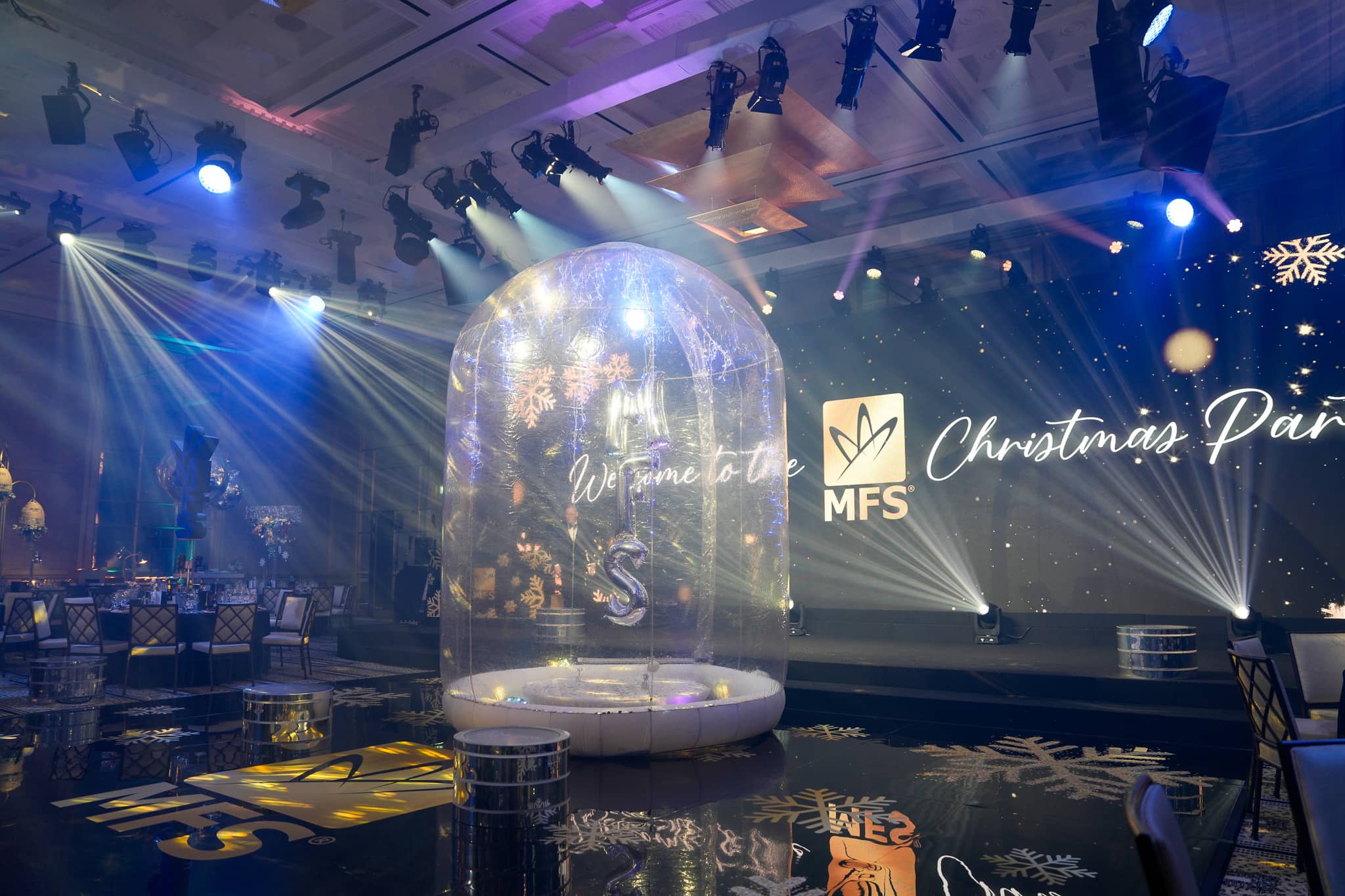 Transparent snow-globe dome on the MFS dancefloor with the Christmas party screen behind