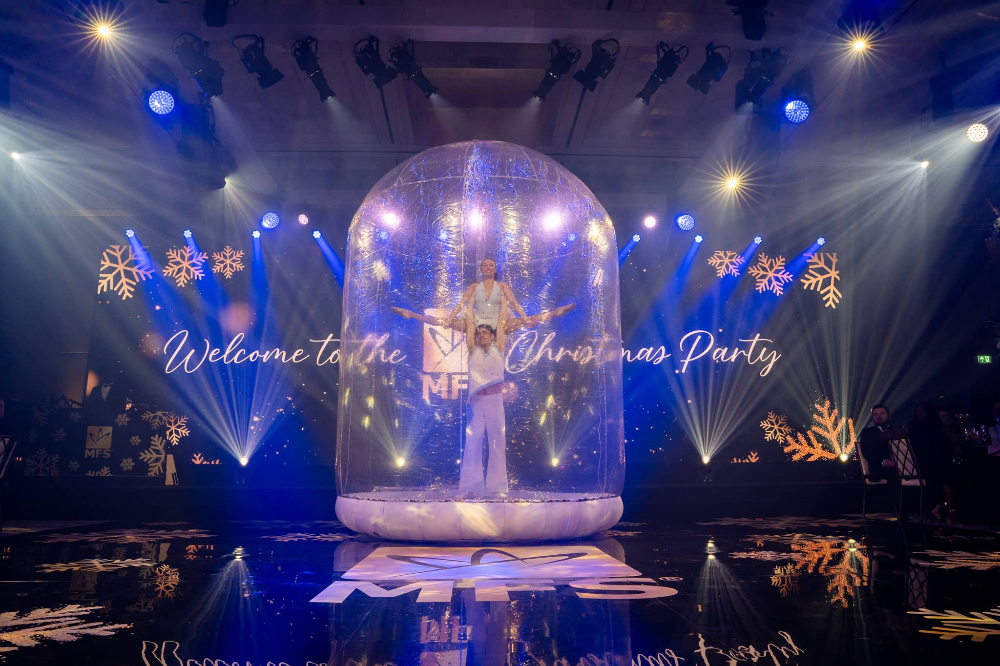 The MFS snow-globe performance reflected in the printed dancefloor at The Peninsula London