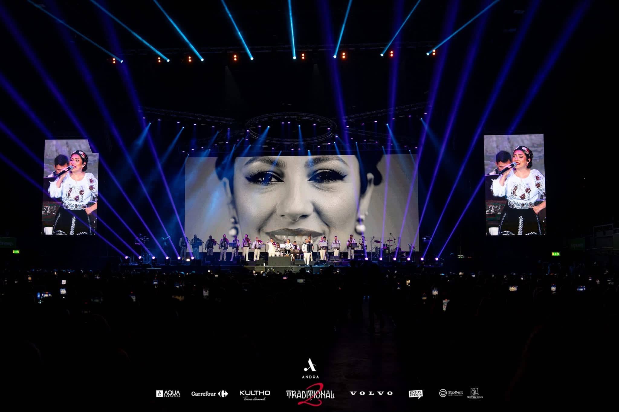 Andra in close up across the 17m LED main screen, live camera on both IMAG screens and a fan of blue beams behind, Andra Traditional 2 at OVO Arena Wembley, LED and video by Kudos AV.