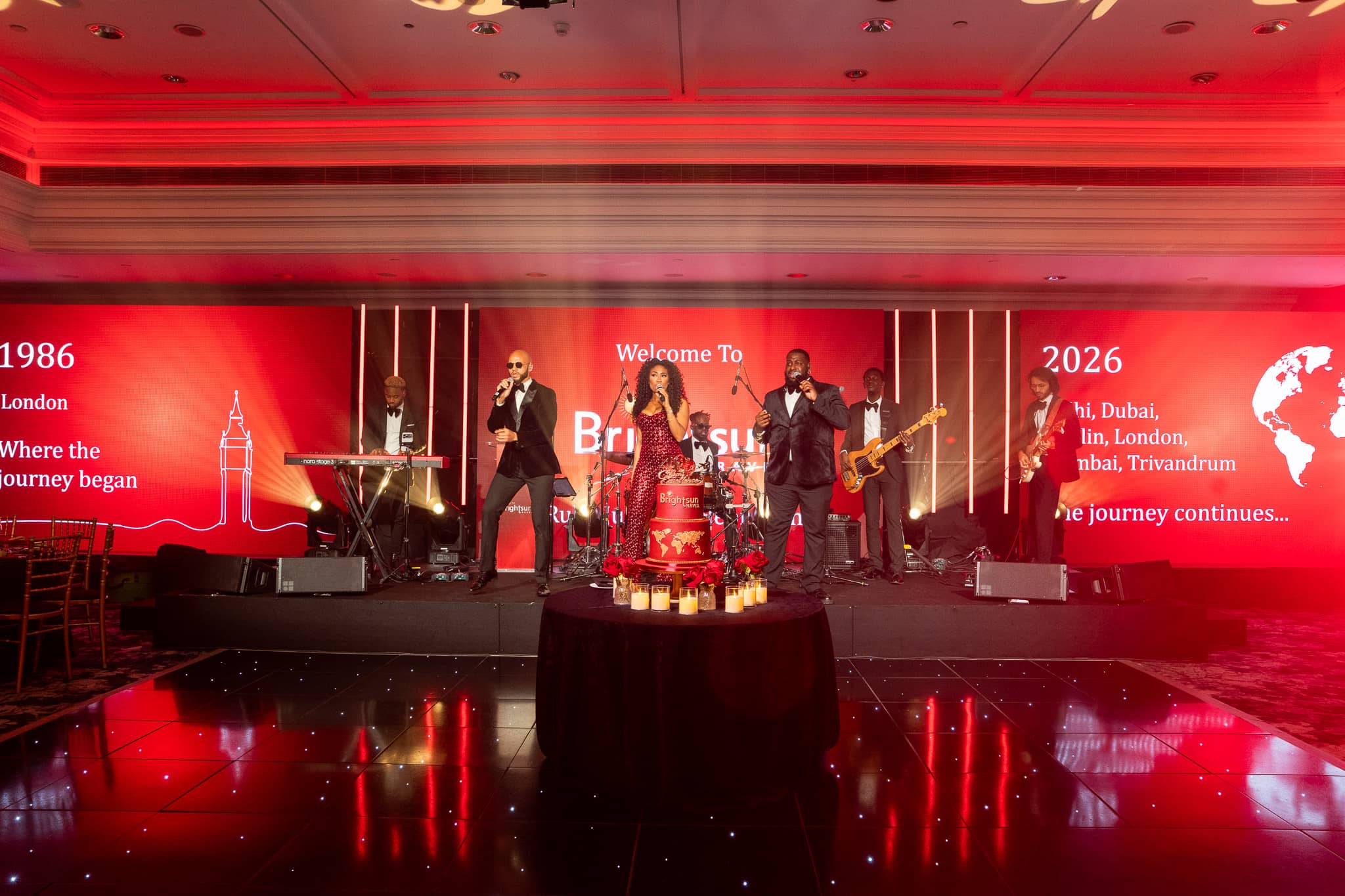Goldn Global performing between the 1986 and 2026 screen graphics, at Brightsun Travel’s 40th anniversary at InterContinental London Park Lane.