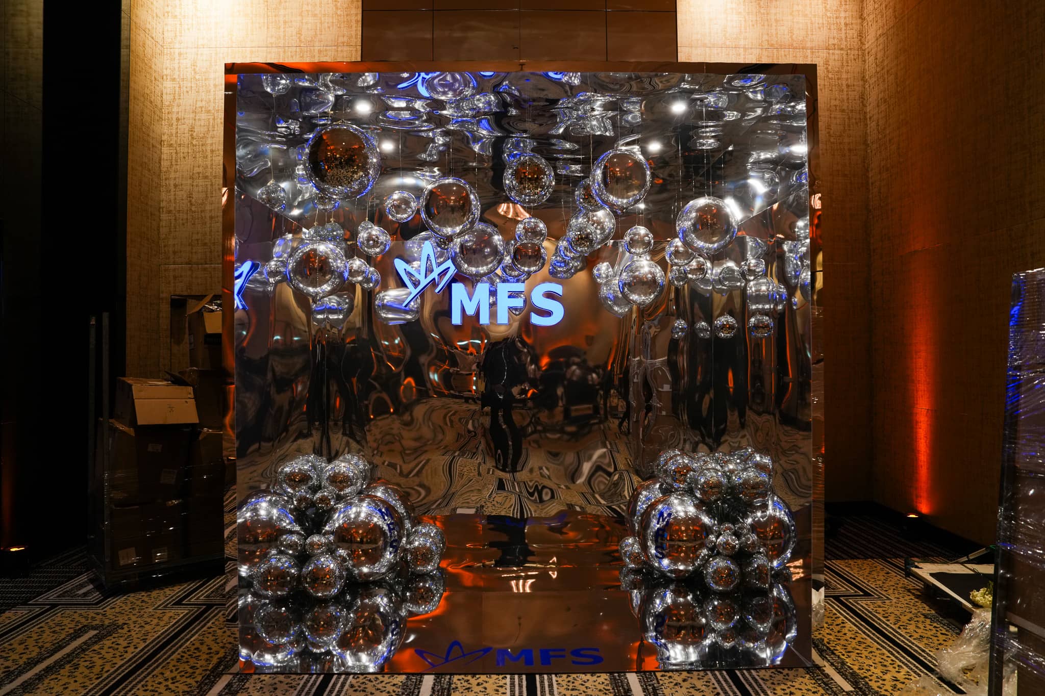 Full view of the MFS mirrored welcome display with silver spheres at The Peninsula London