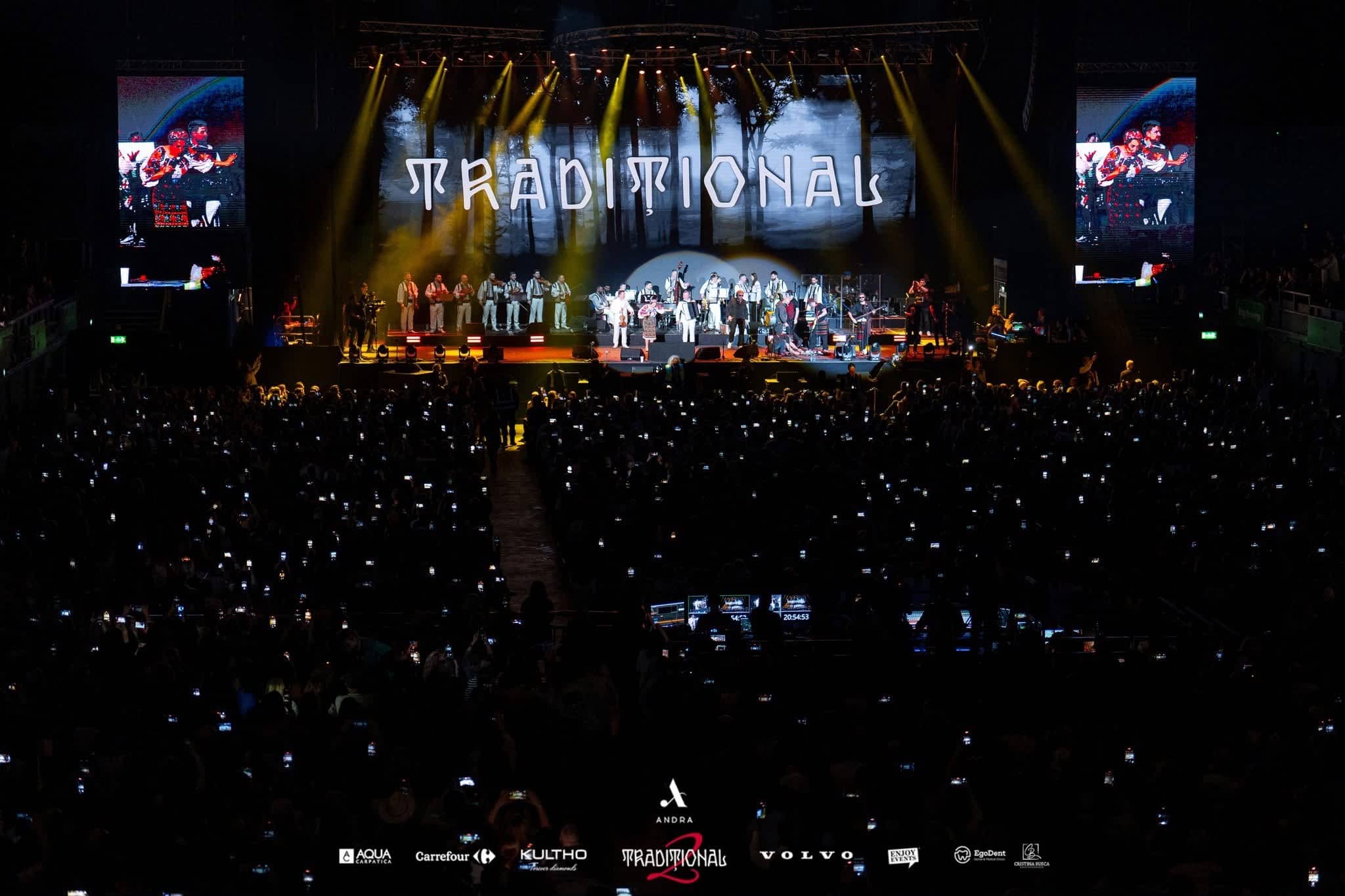 The TRADITIONAL title across the main LED screen with the orchestra on stage and phones raised across the arena floor, Andra Traditional 2 at OVO Arena Wembley, LED, lighting and sound by Kudos AV.