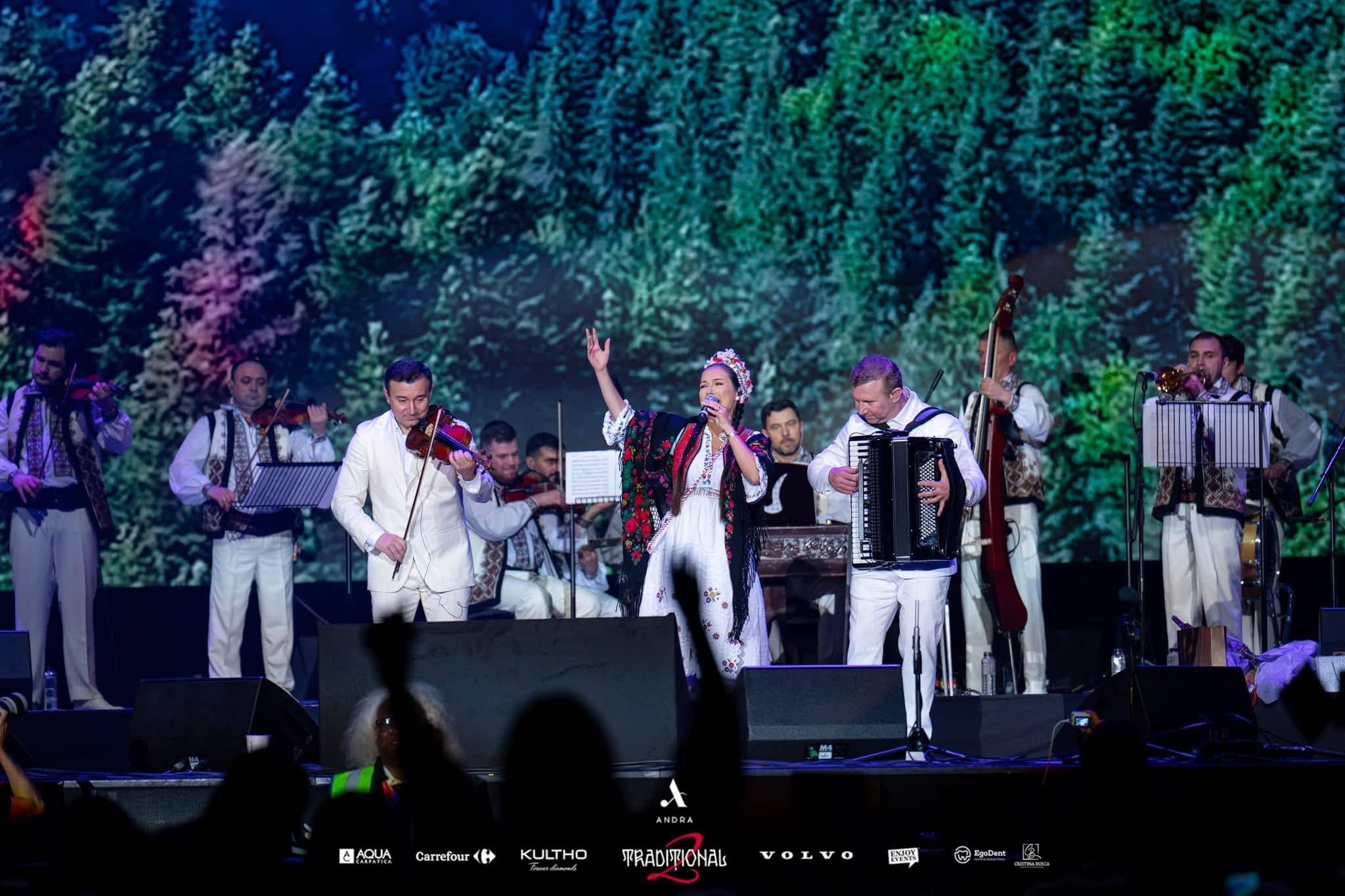 Violin, accordion and the orchestra in traditional Romanian dress in front of a forest scene on the LED wall, Andra Traditional 2 at OVO Arena Wembley, by Kudos AV.