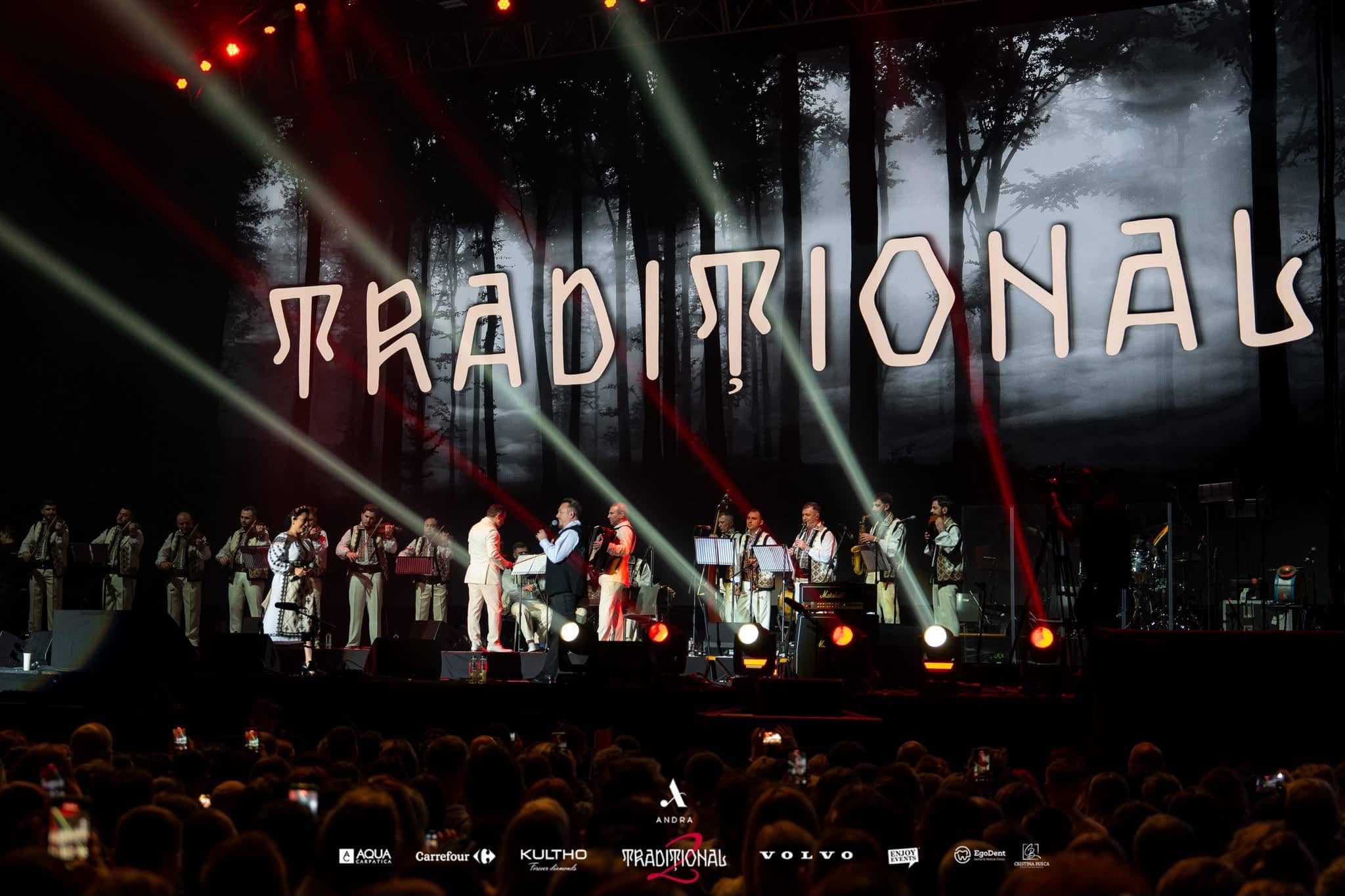 The TRADITIONAL title over a misty forest on the LED wall, the orchestra lit by beams and footlights, Andra Traditional 2 at OVO Arena Wembley, LED and lighting by Kudos AV.