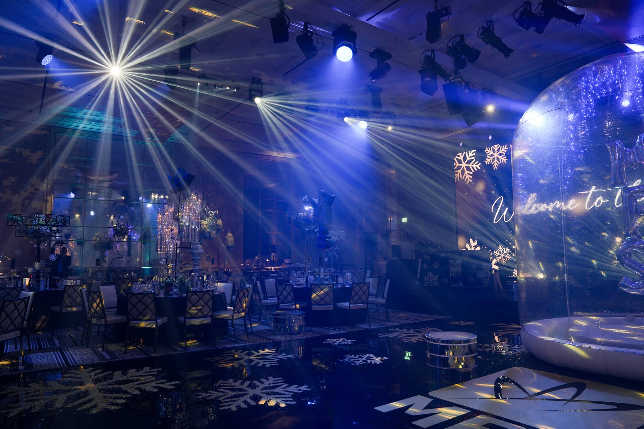 White beam lighting over the dinner tables and printed MFS floor at The Peninsula London