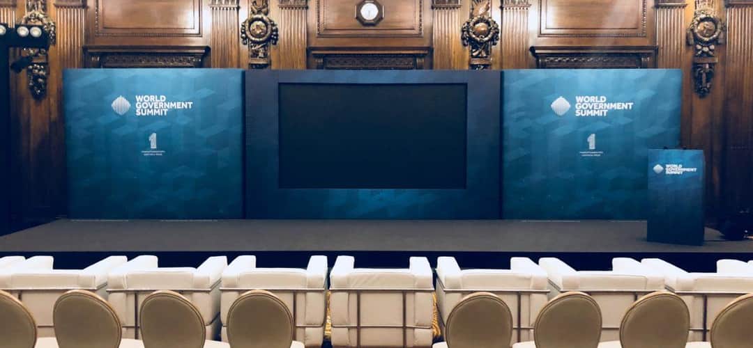 A branded conference set with printed panels and presentation screens by Kudos AV