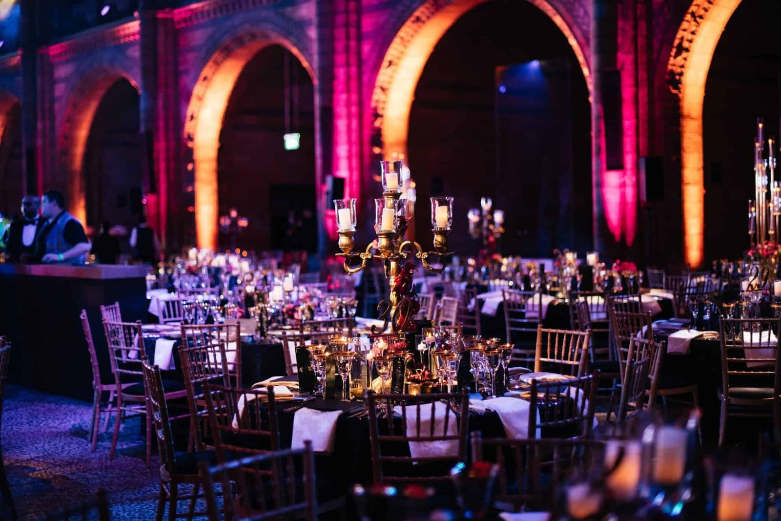 Kudos 10 at the Natural History Museum, banquet tables with candelabra and guests, by Kudos AV