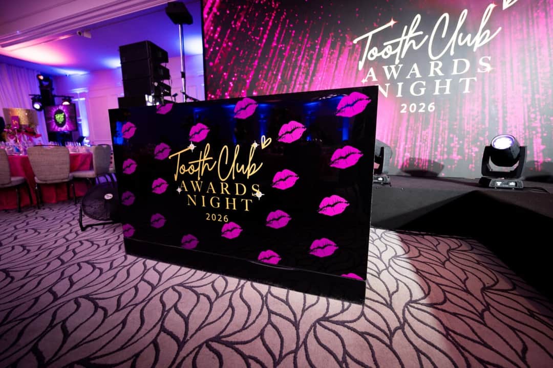 Stage screens and lighting at a corporate conference produced by Kudos AV