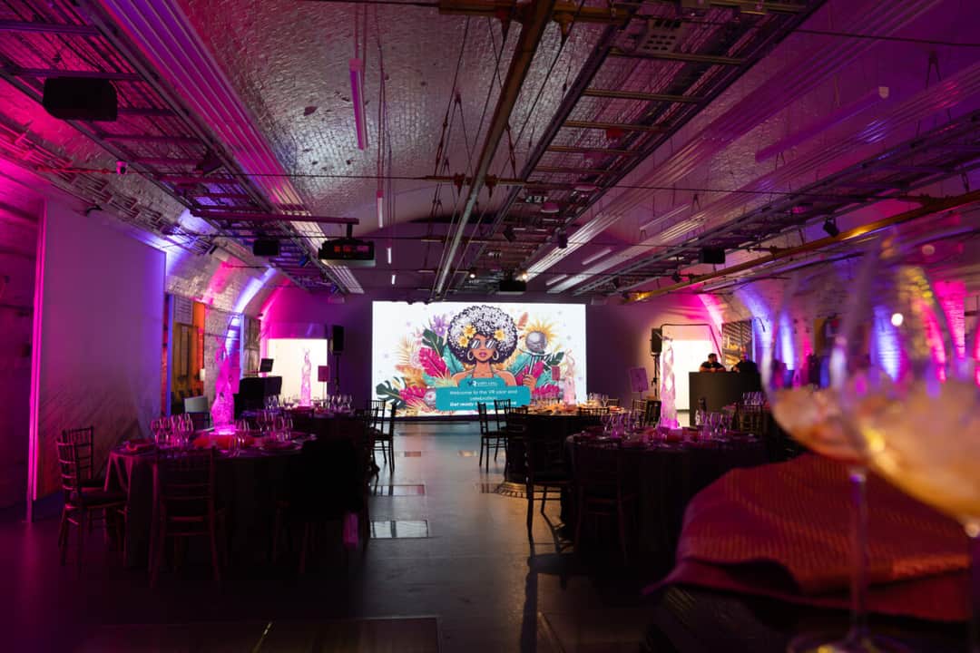 Foldster LED totem screens flanking a conference stage