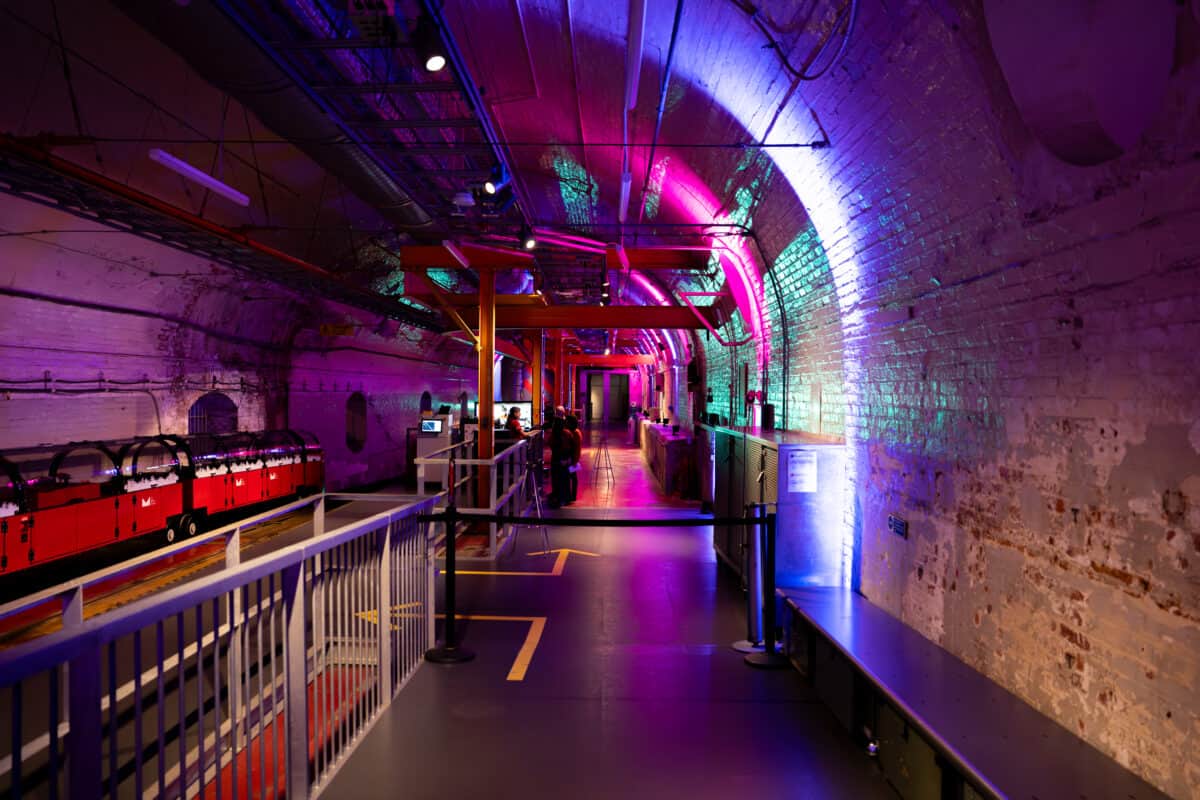 The Mail Rail underground railway platform at The Postal Museum lit for an event by Kudos AV