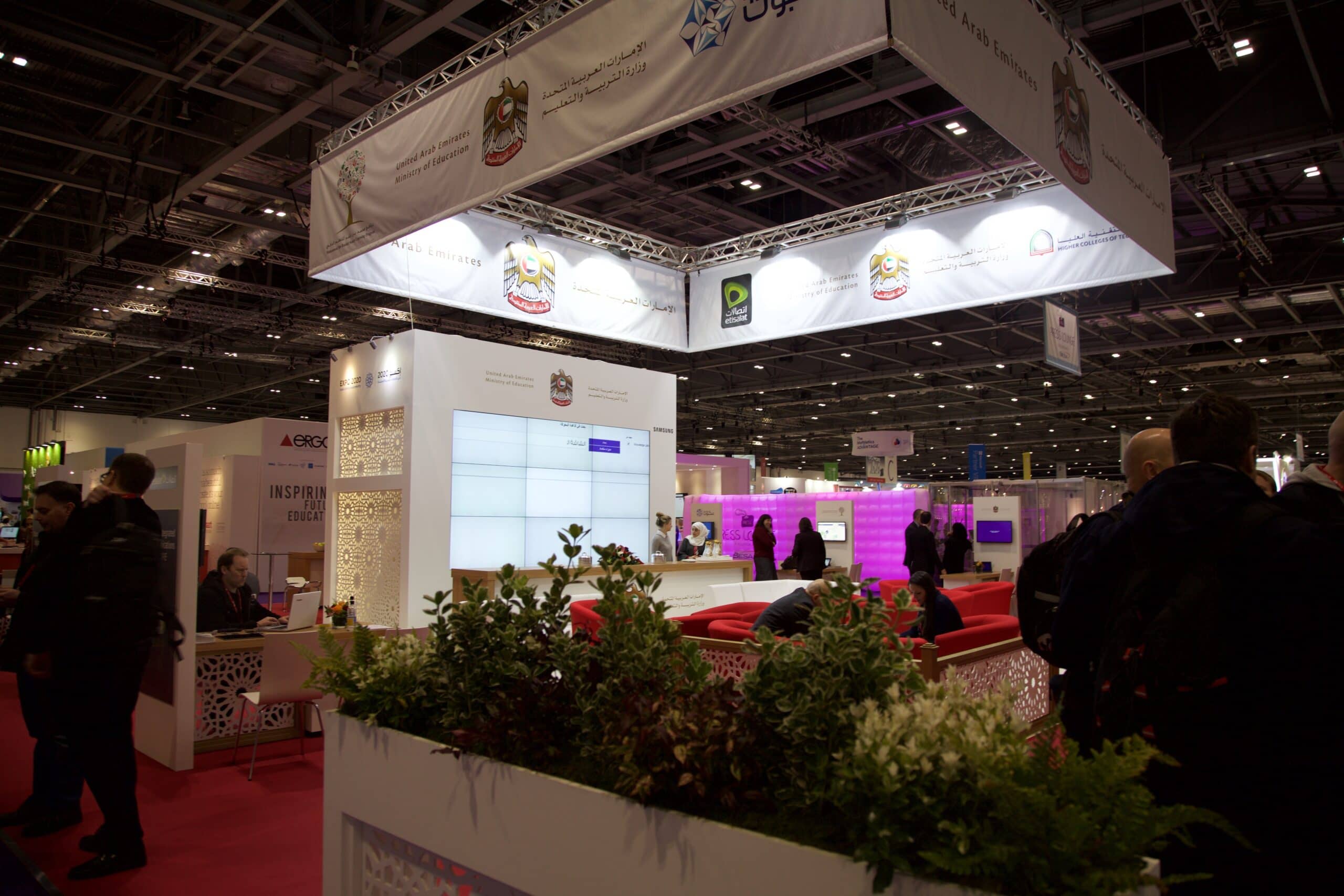 Exhibition stand with integrated screens and hospitality by Kudos AV
