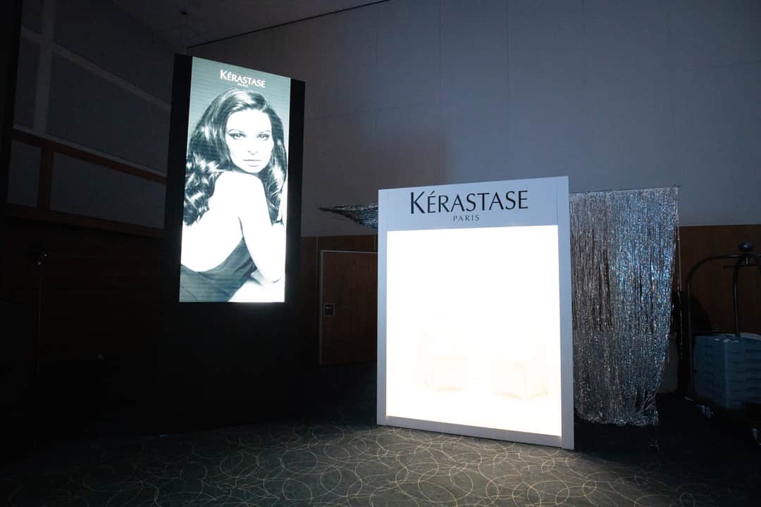 A backlit branded lightbox panel at a product launch produced by Kudos AV