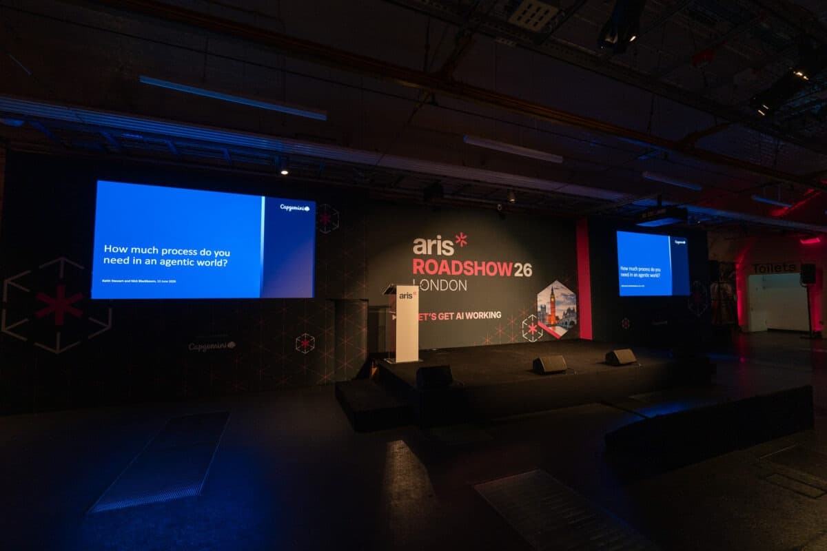 A hybrid-ready conference set with branded panels and screens, produced by Kudos AV