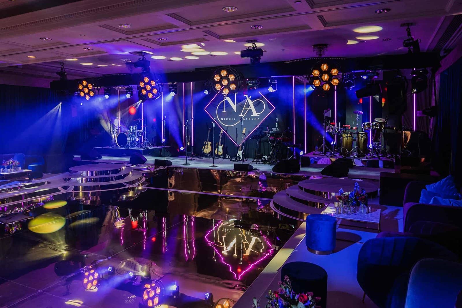 Wedding at Rosewood London, the reception room with LED monogram screens and purple lighting, by Kudos AV