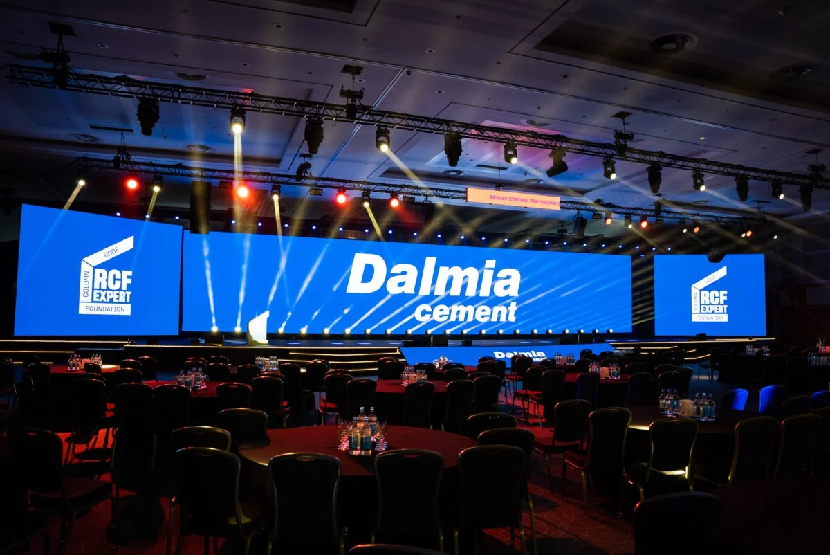Wide LED stage and side screens at the Dalmia Cement event, produced by Kudos AV