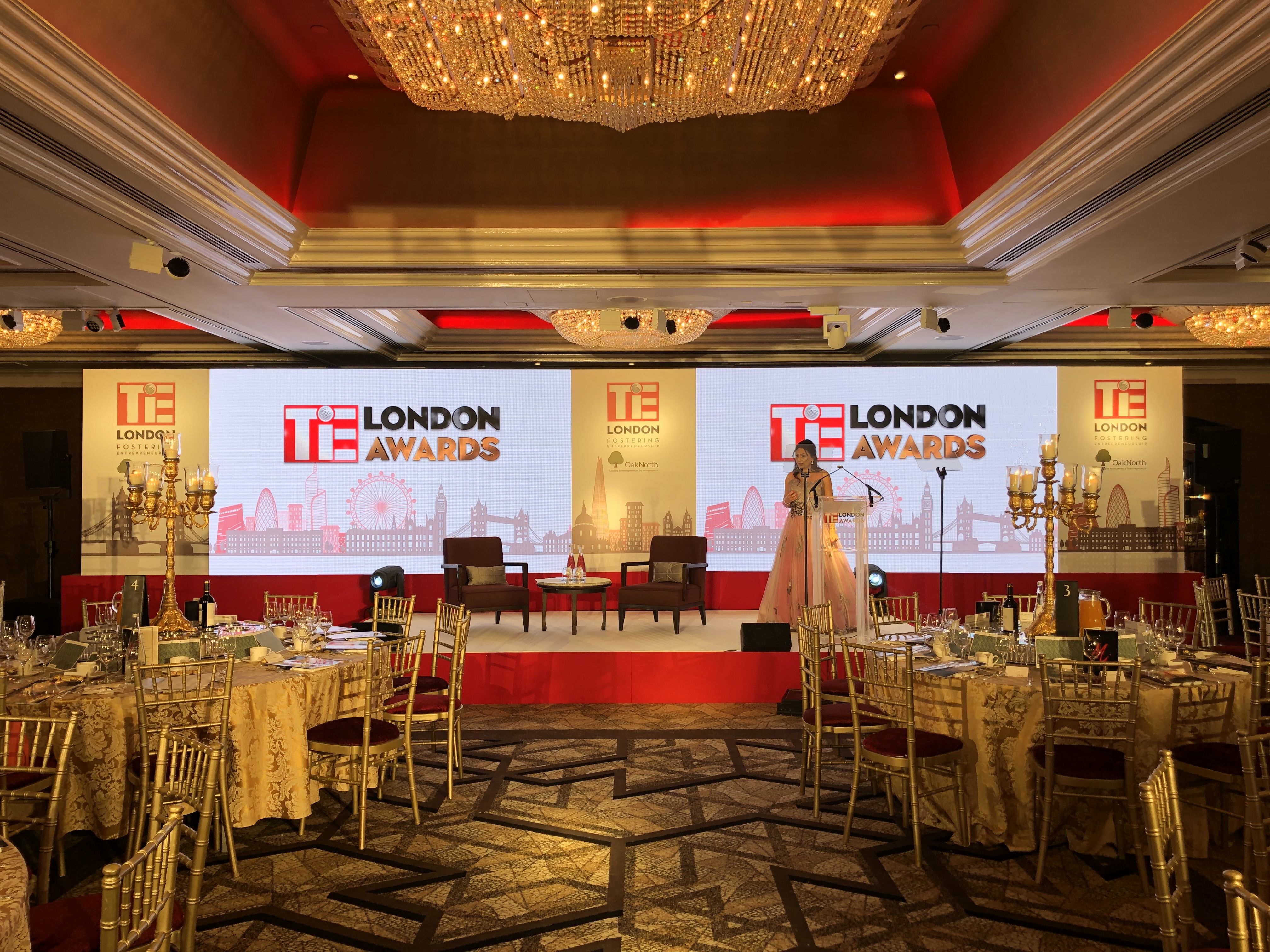 TiE London Awards stage setup with dual LED screens and London skyline scenic panels, Jumeirah Carlton Tower