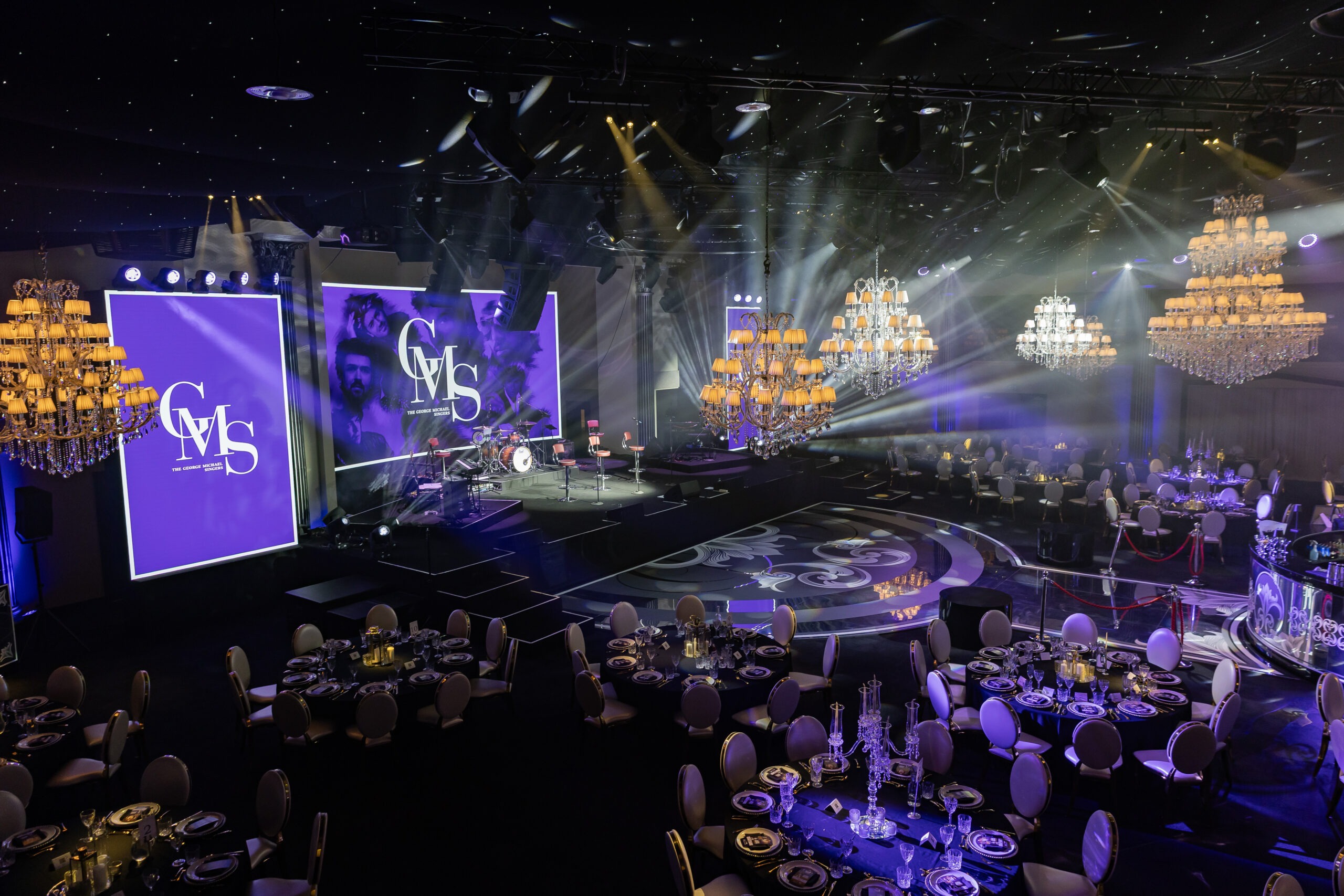 The George Michael Singers Live at IXL Events Centre: 240-cover gala dinner with purple beam lighting show and three LED screens, Kudos AV production, May 2026